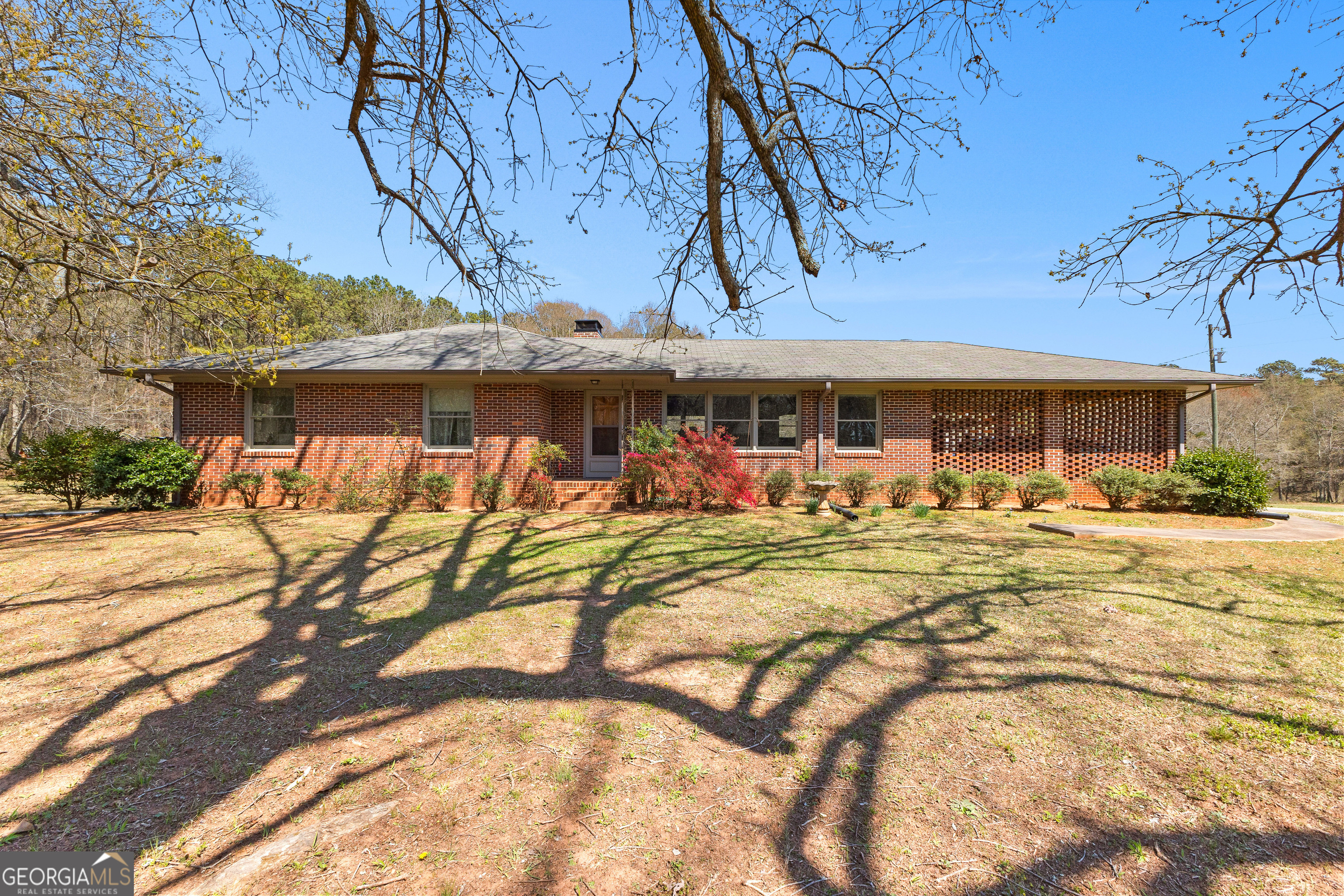 Endless Potential on Nearly 31 Acres in Prime McDonough Location! Discover the rare chance to own nearly 31 acres of beautiful land in one of McDonough's most desirable areas. Tucked away yet just minutes from downtown McDonough, schools, shopping, and I-75, this property offers the perfect mix of privacy and convenience. The well-maintained 3-bedroom, 1-bath home features a cozy living room centered around a classic masonry fireplace and a welcoming kitchen with adjoining dining space - ideal for everyday living or gathering with family. The full unfinished basement with both interior and exterior access provides plenty of room for storage, a workshop, or future expansion. Step outside to enjoy the beautiful yard surrounded by mature trees and open space, offering endless opportunities for outdoor living. Whether you're dreaming of a private estate, recreational retreat, or future development potential, this property is a blank canvas ready for your ideas. Don't miss your opportunity to claim this incredible property in a location where land like this is truly hard to find! Additional connecting acreage with homes available to make a combined total of approximately 90 contiguous acres - presenting an exceptional opportunity for large-scale development or investment.