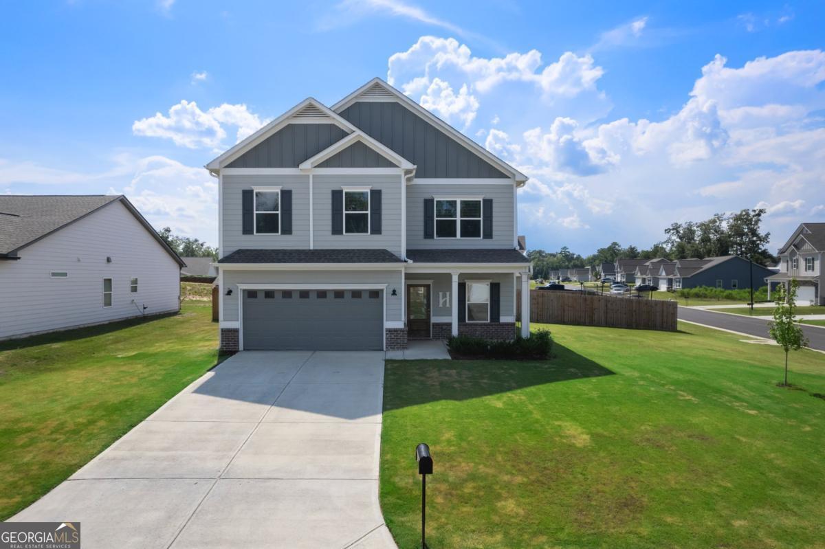 Welcome to The Harrington, the largest floor plan in Emerald Oaks Estates, perfectly positioned on the community's largest lot at the corner of Royal Oak and Rambling Oaks! This spacious home offers an incredible blend of comfort, space, and style, all within the highly sought-after Armuchee School District. Conveniently located just minutes from Berry College, the Rome Braves stadium, and local dining and recreation, this home checks every box! Step inside to discover an airy, open layout featuring 9-foot ceilings on both levels and abundant natural light from the thoughtfully added extra windows. The heart of the home is the open concept kitchen, complete with a center island, stainless steel appliances, white cabinetry, a vented microwave, and a cozy breakfast nook. The living room flows seamlessly to an extended, partially covered patio-perfect for relaxing or entertaining. Upstairs, the oversized owner's suite is a true retreat, featuring dual walk-in closets, a soaking tub, separate shower, private toilet room, and ample space to unwind. Three additional bedrooms, a full bath, and a convenient laundry room round out the second floor. With the largest floor plan on the largest homesite in the neighborhood, this exceptional home offers unmatched value, comfort, and convenience. Don't miss your chance to own this stunning home in Emerald Oaks Estates-schedule your private tour today!