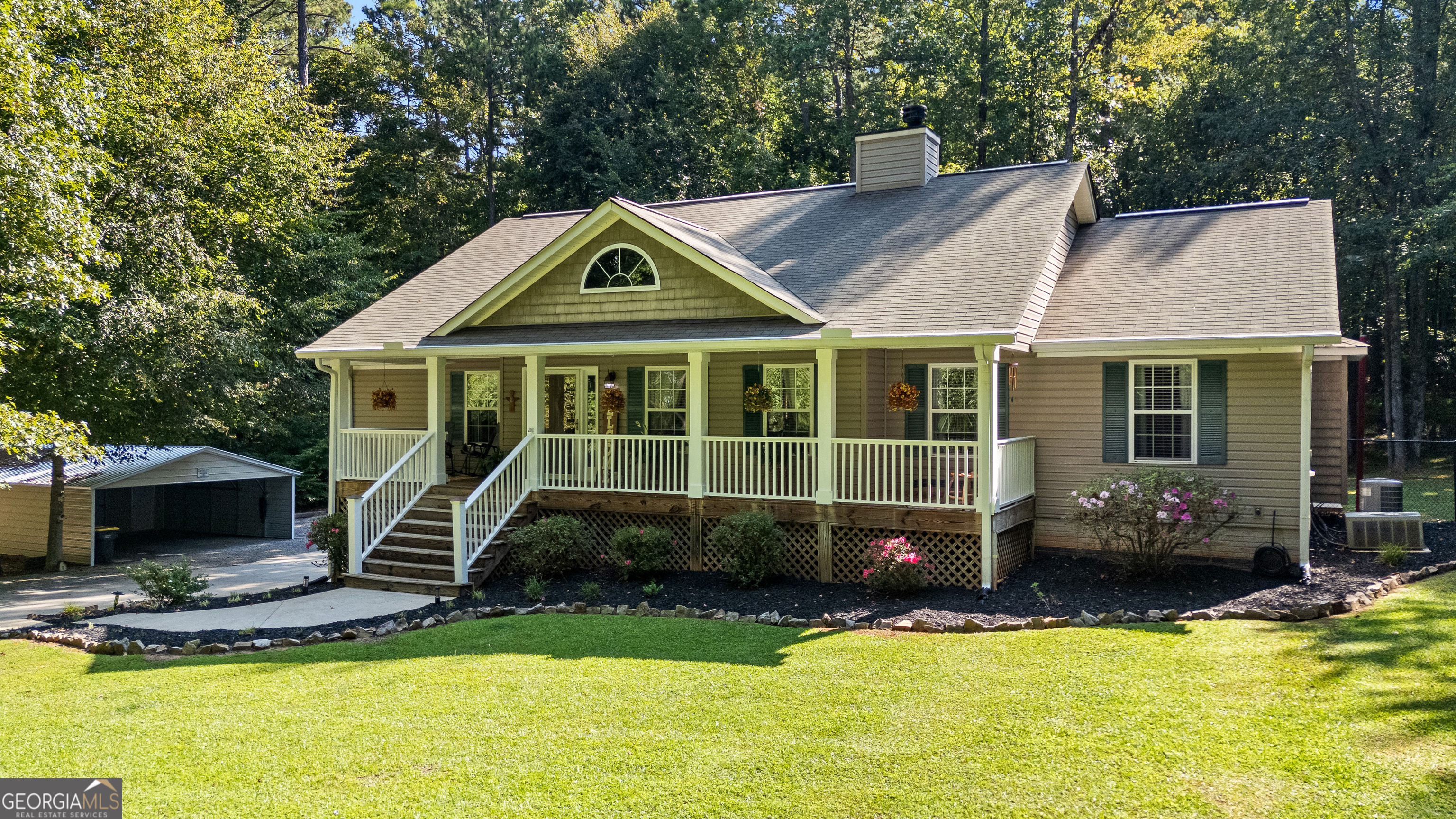 Welcome to this charming 4 bedroom, 3 bath home with finished basement on 5 acres. Family room with wood burning fireplace. Kitchen with tile backsplash, dining area, island, pantry and stainless steel appliances. Master Suite has double vanities, separate shower, 6 foot jacuzzi tub. Finished basement would be a perfect in-law/teen suite with a living room, bedroom and full bath. This property blends spacious indoor living and serene outdoor space. This lot located at the end of the cul-de-sac offers privacy and plenty of room for outdoor amenities and gardening. You'll enjoy views from the rocking chair front porch or the screened back porch and patio. There is an oversized detached 2 car garage in addition to an attached 2 car garage and carport. Lots of storage. Windsor Downs is a peaceful semi rural neighborhood yet still accessible to Newnan amenities.