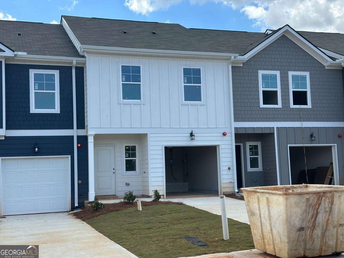 NEW CONSTRUCTION - TOWNHOMES:: Welcome to The Collection at Walden Park - One of Rockhaven Homes' Newest Townhome Communities! Experience the perfect blend of affordable luxury in this beautifully designed neighborhood. Introducing the 'Astin B' floorplan, offering a thoughtfully designed living space. This stunning townhome features modern upgrades and a contemporary open-concept layout. The gourmet kitchen boasts granite countertops, stainless steel appliances, and elegant 42-inch white cabinets with crown molding. Enjoy the convenience of keyless entry, 2" wood-faux blinds throughout, and the latest in smart home technology. Upstairs, the luxurious owner's suite offers tray ceilings, a spa-like bath with an oversized shower, a separate water closet with a window, and a huge walk-in closet. Two additional generously sized bedrooms feature vaulted ceilings, ample natural light, and spacious closets. A one-car garage with automatic door openers adds extra convenience. Located in The Retreat at Walden Park, residents enjoy resort-style amenities, including a swimming pool, cabana, playground, dog park, and scenic walking trails. Plus, with easy access to shopping, dining, and major highways (I-75 & I-285), commuting is a breeze. Don't miss your chance to be one of the first to call Walden Park home! Schedule your tour today before it's too late! APPROX MOVE IN - JULY/AUG 2025!!!