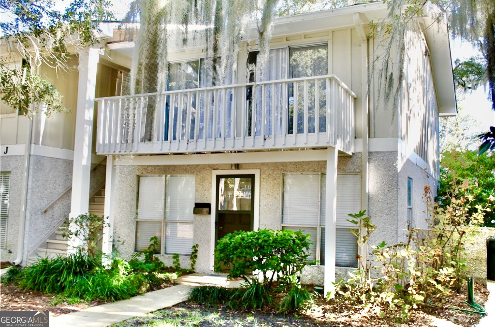 Location, Location, Location South St Simons for under 300k. This Village Green condo is perfect for a weekend getaway or investment property. Tucked away under a beautiful live oak canopy in South St Simons, it is only a short bike ride to the beach or a quick walk to the shopping, restaurants, and nightlife of the St Simons Village. This 1 BR 1 BA unit has a nice living area that opens out to a large front deck perfect for entertaining with beautiful views and shade from the large live oaks that cover the property. Unit has washer and dryer. Water and Basic Cable are provided by the Association as part of the dues.