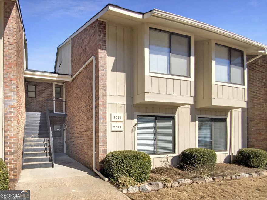 Seller is willing to cover up to six (6) months of buyer's Homeowners Association (HOA) dues with an acceptable offer. Welcome to this charming property that boasts a cozy fireplace, creating the perfect ambiance for those chilly evenings. The natural color palette throughout the home adds a sense of warmth and tranquility. The kitchen features a nice backsplash, adding an extra touch of style to the space. The primary bathroom offers good under sink storage, keeping your essentials neatly organized. Enjoy the peaceful and serene atmosphere of this lovely home. Don't miss the opportunity to make this your own retreat! Enjoy the community pool! The convenient location is close to Atlanta with easy access to major highways, Braves stadium and the Battery, shopping and dining venues, plus nearby parks.