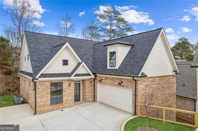 Luxury Resale in Horseshoe Bend - Homesite 3 Immaculate and move-in ready, this custom residence offers luxury living in Roswell's newest 19-lot enclave within the Horseshoe Bend community. This home features 4 bedrooms, 4 bathrooms, and a versatile bonus room. It's one of the few homes with a primary suite and guest bedroom on the main level. Inside, you'll find a thoughtfully designed floor plan perfect for everyday living and entertaining. An expansive 12+ seat dining room with cedar beams sets the tone, leading into a spacious living area and chef's kitchen. The kitchen boasts a large island, premium Bertazzoni appliances, and quartz countertops. Other highlights include: four-sided brick exterior, two covered decks, hardwoods throughout, custom trim work throughout, woven wood shades, 2-car garage with EV charger, and an unfinished basement ready for future customization. Prime location, just minutes to GA-400, vibrant Downtown Roswell, Avalon's shopping, and nearby parks and bike paths.