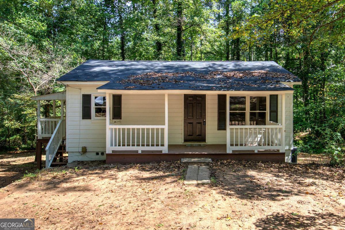 Welcome to 269 Bobo Road in Dallas, Georgia. This beautifully renovated ranch-style combines modern upgrades with classic charm, creating a move-in-ready retreat. Inside, the home showcases refinished wood flooring throughout, freshly painted interiors, and sanded ceilings and walls for a smooth, updated finish. Every room is enhanced with stylish new light fixtures, while three new interior doors add consistency and character throughout. The kitchen has been thoughtfully updated with freshly painted white cabinets, new granite countertops, a new sink and exhaust hood, and a brand-new Samsung stainless steel stove. An ice-maker water line has been added for convenience, making the space as functional as it is attractive. The primary suite and an additional bedroom are located on the main level, offering comfort and flexibility. The bathroom has been refreshed with a painted tub and a new insert. A new 2-ton Goodman HVAC system ensures energy-efficient climate control, while plumbing has been brought up to code. Additional mechanical updates include a septic system that has been pumped and inspected. Exterior updates elevate both curb appeal and peace of mind. The home boasts a brand-new roof (April 2025), reinforced side porch support beams, new stairs, siding repairs with fresh paint, and professional landscaping with a gravel driveway and newly planted grass in the front yard. With a complete termite inspection, ample parking, and every major system updated, this home offers the perfect balance of character, quality, and convenience.