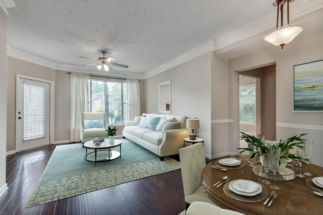 Welcome home to this pristine end unit condo in a gated community right in the heart of Sandy Springs! This 1st floor unit was just freshly painted and boasts hardwood floors throughout (except carpet in guest bedroom), high ceilings, a large eat-in kitchen with stainless steel appliances, a Ring doorbell & Nest thermostat, and a renovated master bathroom. Spacious dining/family room combo with large windows leads out to a private covered balcony. Great roommate floorplan with oversized bedrooms on each end of the condo, both equipped with huge walk-in closets! This condo is loaded with extra storage, with two closets in the foyer and an additional closet on the outside covered balcony. Take advantage of the amazing amenities that include a community pool, fitness center, and beautiful landscaping. Excellent location close to 400 and 285, with tons of nearby grocery stores, restaurants, shopping, hospitals, and more.