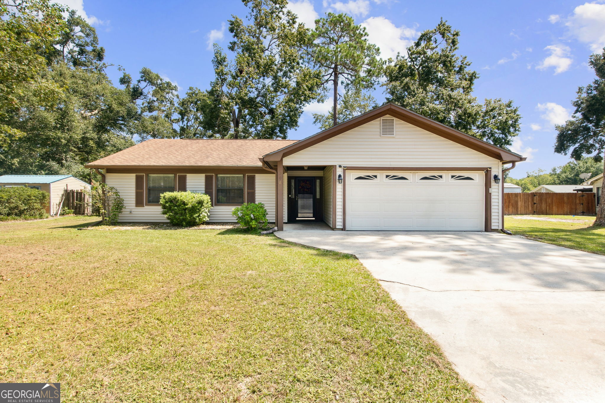 Looking for your new "Home Sweet Home"? Then look no further! This charming 3 bed, 2 bath home is move-in ready and waiting just for you! Located just minutes from the Kings Bay Naval Base, this beauty offers a spacious layout and a large finished bonus room with decorative wood barn door, perfect for a second living space, office, playroom, or gym! Step inside to enjoy vaulted ceilings in the main living area, beautiful wood look flooring, fresh interior paint, and a seamless flow into the dining area and kitchen. The kitchen features granite countertops, plenty of storage, stainless steel refrigerator & microwave, and updated dishwasher. The owner's suite features a walk-in closet and private bath. Two guest bedrooms and a full guest bath are located on the opposite hallway, with both having the gorgeous wood look flooring that matches the main living area. The backyard is fully fenced making it great for pets or relaxing weekends around your fire pit! This home also features a two-car garage, low-maintenance vinyl siding, NO HOA, and a convenient location near well rated elementary schools, Crooked River State Park, shopping, and dining! Schedule your private tour today!
