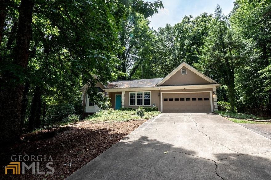 Highly sought after Ranch on an unfinished basement! This wonderful 3 bed 2 bathroom home has been well maintained and is located in the tranquil Hill Top neighborhood. The living room includes a beautiful pitched ceiling with 2 skylights providing plenty of natural light. It also has an entire wall of bookshelves and a gas fireplace making for cozy reading. The kitchen conveniently maintains clean lines of sight into the living room and includes a gas stove, dishwasher, and refrigerator. The formal dinning room has plenty of space for hosting or enjoying a meal. Past the living room, the owners suite includes his and her closets, with easy access to the primary bathroom. On the other side of the home there are 2 additional bedrooms and 1 full bathroom. Both the bedrooms and bathroom provide ample space. Stairs located next to the living room lead to the unfinished basement. The basement has plenty space and is full of potential. There is even a garage door to access the basement located on the side of the house, making moving large furniture or equipment into the basement a breeze. So much to like about his home. Easy access to restaurants and shopping, with a new Publix being built near the neighborhood. Schedule your showing today!