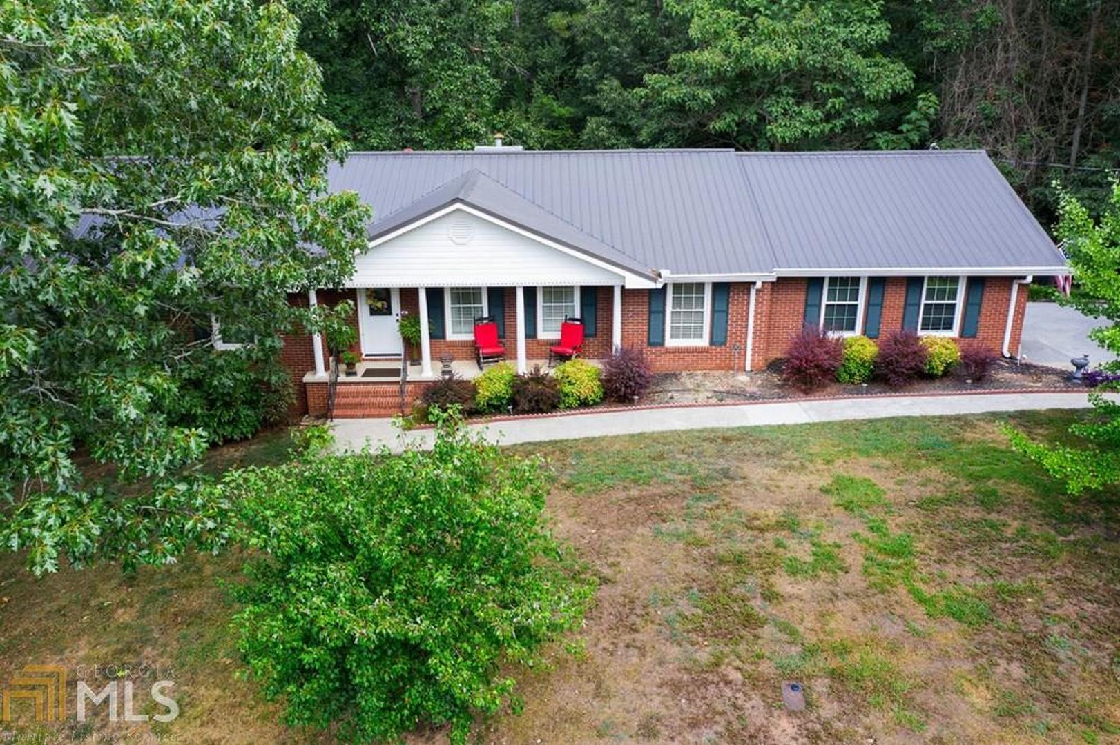 IN THE CITY! This lovely 4-side brick home in Camelot sits on a corner lot. Ranch over full basement; 3 bedrooms, 2 full bathrooms. Over-size family room with gas log fireplace, spacious kitchen with hard surface countertops, large pantry. Separate dining room. Mudroom with entrance from garage and exit to backyard. Basement is partially finished and has a storm room, cedar lined closet, and lots of room for additional living space. Double-pane windows; covered deck. Gazebo with natural gas hook-up for grill.