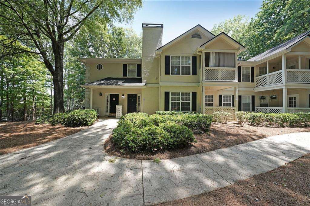 Welcome to 1005 Peachtree Forest Terrace, a charming and desirable ground-level condo with no steps to enter-perfect for easy access and convenient living! Tucked quietly in the back of the building, this home offers peaceful privacy with serene wooded views, creating a relaxing retreat right in the heart of Peachtree Corners. Step inside to find an open and inviting floor plan, ideal for both everyday living and entertaining. Large windows let in natural light while showcasing the beautiful, wooded backdrop. Enjoy morning coffee or an evening glass of wine surrounded by nature just outside your door. This well-maintained community features a sparkling pool for summer relaxation and is just minutes away from a major tennis and pickleball complex, making it a great spot for active lifestyles. Location is unbeatable! Just minutes from The Forum and Peachtree Corners Town Center, offering fantastic dining, shopping, and entertainment options. Close to scenic parks, walking trails, and Chattahoochee River recreation spots. Easy access to GA-141/Peachtree Parkway for a quick commute to Atlanta or nearby business centers. Whether you're looking to downsize, buy your first home, or invest in a low-maintenance property, this condo checks all the boxes-private, convenient, and move-in ready! Don't miss the chance to own this rare, step-free condo in one of Peachtree Corners' most sought-after locations!