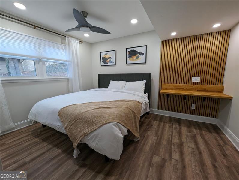 Unwind in this fully renovated haven, perfect for families, groups, couples, or solo travelers. Relax on your private balcony overlooking a verdant oasis. Spacious living areas invite movie nights & game nights. Dedicated workspaces in each bedroom & a communal area keep professionals productive. Whip up feasts in the gourmet kitchen or chill on the deck. Large TVs in every room & wall games offer endless entertainment. Explore East Cobb's charm, parks, & vibrant city nearby.