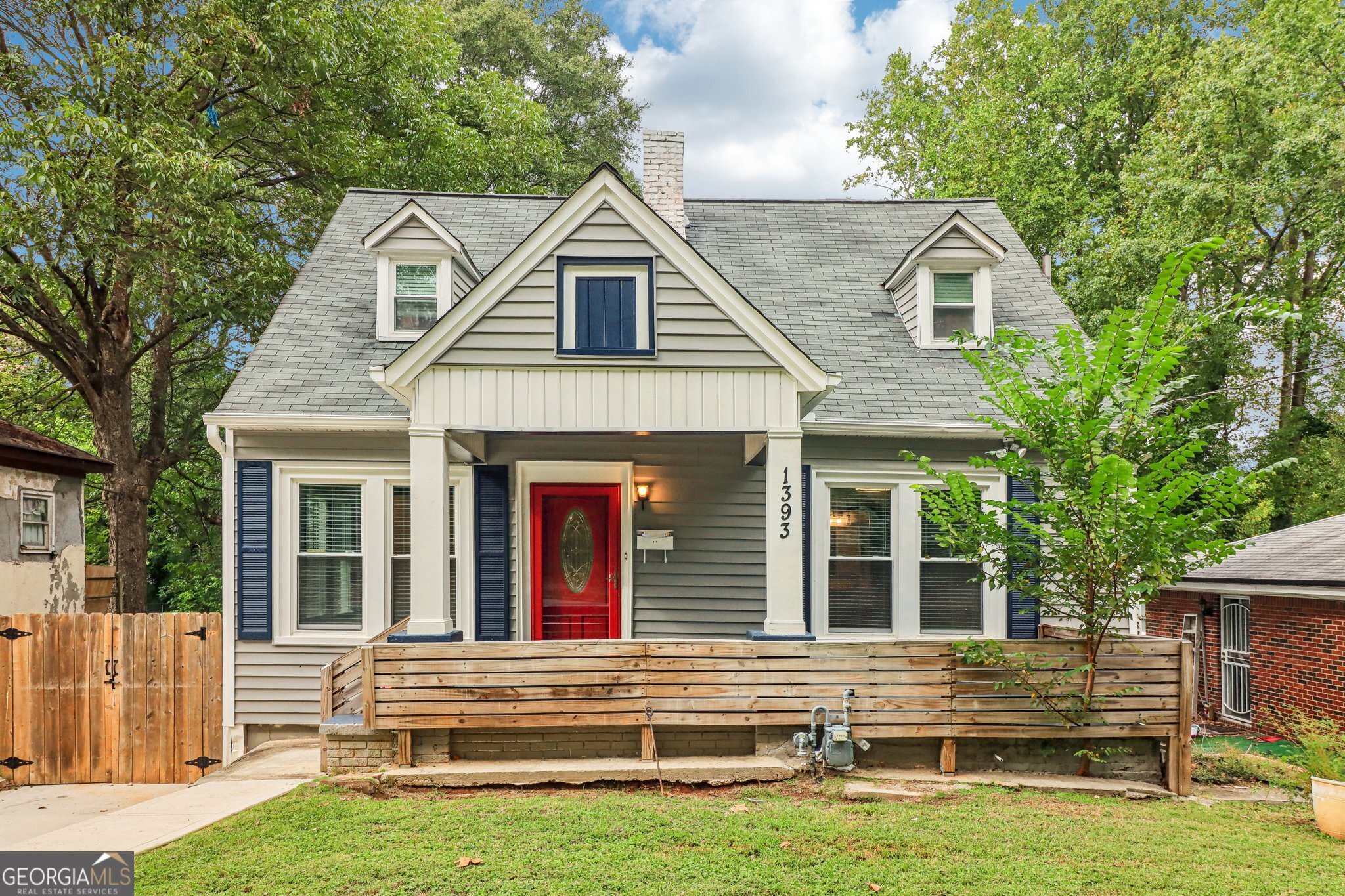 Step into this beautifully renovated 5-bedroom, 4-bathroom home in the heart of Atlanta's historic Westview neighborhood, just minutes from the BeltLine, West End, and Downtown. Boasting over 2,700 square feet of living space, this home blends modern comfort with timeless charm - ideal for multi-generational living, remote work, or entertaining. Inside, you'll find a main-level primary suite with a spa-like ensuite bath featuring a soaking tub, walk-in shower, double vanity, and barn door entry. A second bedroom and full bath on the main floor offer added convenience for guests or family. The open-concept living room welcomes you with a cozy fireplace and flows into a chef's kitchen outfitted with granite countertops, stainless steel appliances, and custom cabinetry-perfect for everyday meals or hosting. Upstairs includes two additional bedrooms with a shared full bathroom featuring a walk-in tiled shower and double vanity. The fully finished terrace level is a standout feature-complete with a second living area, fifth bedroom, and a fourth full bathroom. Whether used as an in-law suite, home office, gym, or guest retreat/potential rental space, this level adds flexibility and value. All bathrooms are custom designed with designer tile and double vanities, and ceiling fans throughout the home include built-in Bluetooth speakers-ideal for entertaining or unwinding with your favorite playlist. Enjoy the large, fully fenced backyard, perfect for outdoor entertaining, gardening, or pets. This move-in ready gem offers modern upgrades, a spacious layout, and unbeatable value in a neighborhood where growth continues to surge. Schedule your private showing today and don't miss the chance to call 1393 Westview Dr. home!