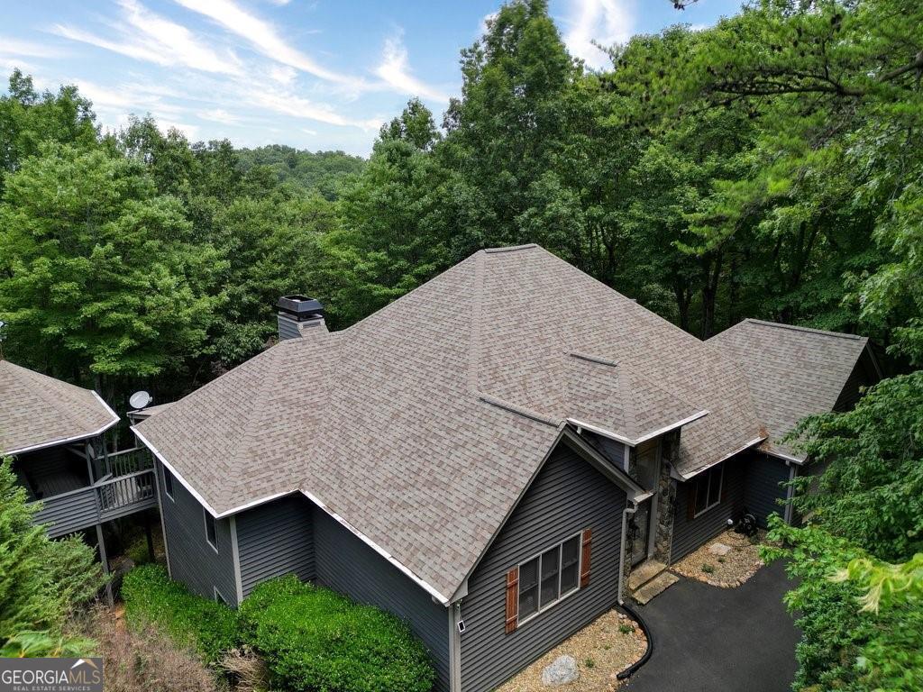 Welcome to this incredible luxurious mountain retreat! This stunning property has undergone a complete renovation, including roof, with high-end finishes and offers an array of amazing features. Situated on over 2.5 acres of pristine land, this retreat boasts breathtaking long-range mountain views that provide a serene and picturesque backdrop for relaxation and enjoyment. One of the highlights of this property is the incredible open chef's kitchen, which is a culinary enthusiast's dream come true. Equipped with a gas cook-top and double ovens, this kitchen provides ample space for preparing gourmet meals. Whether you are hosting a large gathering or simply enjoying a quiet evening at home, this kitchen is sure to impress. The outdoor area of this mountain getaway is equally enchanting. With carefully designed outdoor lighting, you can create a magical ambiance for evening entertainment or quiet strolls under the stars. The property also features underground utilities, ensuring a seamless and aesthetically pleasing landscape. This retreat is perfect for large groups seeking a luxurious and spacious getaway. The level driveway can comfortably hold multiple vehicles, providing convenience and ease of access. The master bedroom, located on the main level, offers a tranquil haven with its spa-like bathroom. Designed to provide the utmost relaxation, this bathroom is a sanctuary within the retreat. The full finished basement is a versatile space that includes a kitchen, two additional bedrooms, and a full bathroom. This area is perfect for accommodating guests or can be used as a separate living space for extended family members. Additionally, the basement features a massive game area, offering endless entertainment possibilities. To further enhance the appeal of this property, it includes a garage for parking and storage. Currently being used as an investment property, this retreat has proven to generate top returns, making it an excellent opportunity for those looking for both a personal getaway and a wise financial investment. Don't miss out on the chance to own this exquisite mountain retreat. Contact us today to schedule a viewing and experience the luxury and tranquility that this property has to offer.