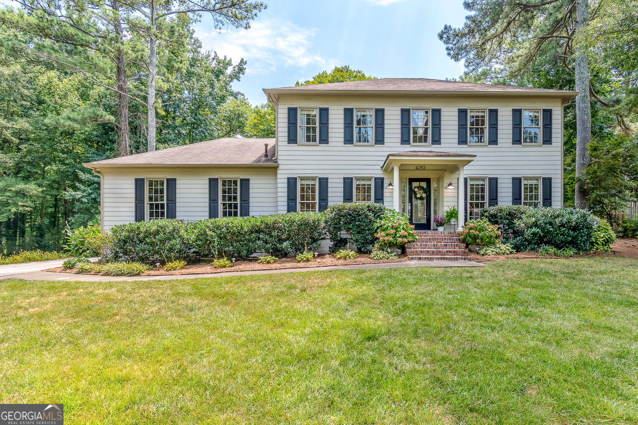 This tastefully renovated home is situated on an incredible landscaped lot with an in-ground pool on a quiet cul-de-sac street. The traditional floorplan features a formal dining room and a formal living room on the front of the house with floor to ceiling windows. The living room has French doors and is currently being utilized as a home office. There is a fireside family room with custom built-ins flanking the updated fireplace. The family room leads to the all seasons sunroom that provides additional living space and overlooks the patio, pool & backyard areas. The fully renovated eat-in kitchen features quartz countertops, shaker style cabinetry, stainless steel appliances, walk-in pantry with custom shelving system, tiled backsplash and a separate coffee bar. The breakfast table is situated in a bay window that overlooks the pool. The updated mud room-laundry room also features custom storage. Upstairs the generously sized primary bedroom easily fits a king suite of furniture, has a walk-in closet and an ensuite bath with a double vanity, soaking tub and separate shower. Each of the sizable secondary bedrooms have custom closet systems and share an updated hall bath. The backyard is your very own private sanctuary and will bring your outdoor entertaining to the next level! An in-ground gunite pool & separate spa, patio for grilling and dining, fully fenced yard complete with a greenspace to kick the soccer ball plus a playset. Professionally landscaped yard in front and back full of mature landscaping and plenty of light (many trees have been removed), irrigation system in front and back yard, outdoor speakers with Bluetooth amp. The two-car side entry garage is full of shelving for additional storage. Neutral paint throughout, updated lighting, moldings added in dining room, new flooring in the family room, garage doors replaced in 2022, newer HVAC (furnace Oct 2018 & a/c 2020), backyard playset 2021, encapsulated crawlspace & wildlife exclusion. Fantastic location close to parks, downtown Lilburn dining & shopping plus top-rated Gwinnett County Schools. This is a must see!