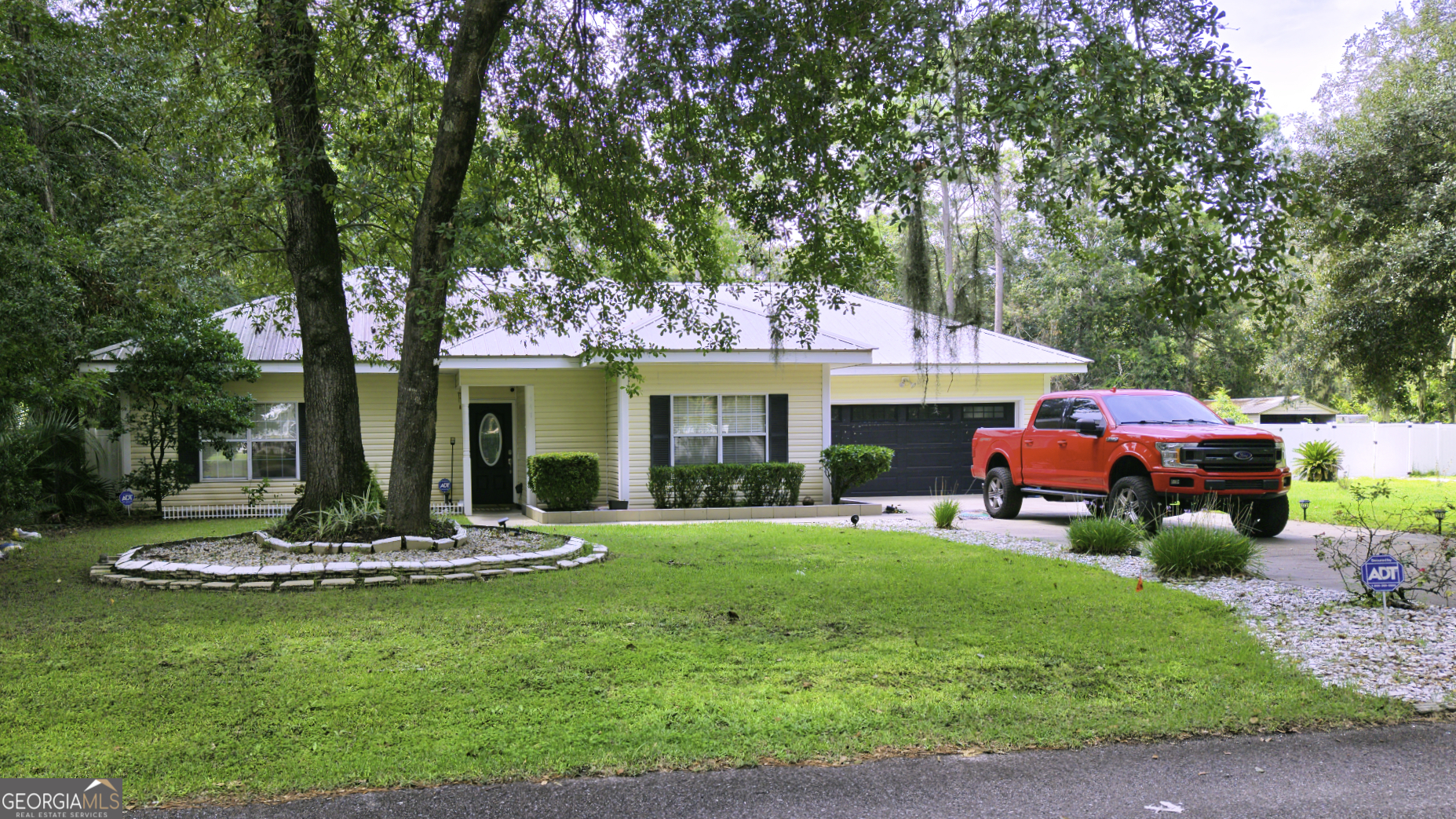 Welcome to 147 Colonial Way, a beautifully maintained smart home retreat in the desirable Helveston Oaks area of Brunswick, GA, in Glynn County. This 3-bedroom, 2-bath home offers 1,378 sq. ft. and was built in 2000 on two combined parcels totaling 0.88 acres-both with septic tanks. The property features a heated inground pool, jacuzzi, pool house, outdoor kitchen, and multiple entertaining spaces-perfect for primary homeowners, coastal lifestyle seekers, investors, or anyone desiring a flexible property near St. Simons Island and the Golden Isles. Inside, you'll find open-concept living and dining areas with abundant natural light. The home has been updated with new terracotta stone wood-grain flooring throughout, except for the mudroom, laundry room, and bathrooms, which feature durable stone tile. The kitchen is thoughtfully upgraded with stainless appliances, stone counters, a tile backsplash, and a spacious island that doubles as a prep space and breakfast bar. Open flow makes it easy to transition between indoor and outdoor entertaining. The owner's suite includes a tiled walk-in shower and dual vanity, while secondary bedrooms offer ample storage. Smart home upgrades include a Nest thermostat, home automation features, and an ADT security system ready for setup by the new owner. Some interior furniture is available for separate purchase, and gazebo furniture conveys with the home (note: not all poolside furniture is included). The backyard oasis is fully enclosed with a vinyl privacy fence and designed for year-round enjoyment. The heated pool and jacuzzi feature a new pool system. A covered pool house patio includes bar seating, dining space, and a built-in bar on the pool house deck for entertainment. The pool house interior is currently unfinished, offering customization potential. A separate gazebo with pool table and lounge furniture (included with sale) provides a versatile hangout, while a gas fire pit extends gatherings into the evenings. The outdoor kitchen includes a stainless steel grill, gas cooktop, mini fridge, and built-in cabinetry. Additional features include: attached two-car garage with attic storage and tank water system, plus a white rock driveway on the second lot-ideal for RVs, boats, or additional parking. Conveniently located near Glyndale Elementary, Needwood Middle, and Brunswick High, the property also offers easy access to shopping, dining, healthcare, and the Golden Isles beaches. Downtown Brunswick's historic district-with its boutiques, galleries, and restaurants-is a short drive away, while St. Simons and Jekyll Island provide golf, fishing, and beaches. This home balances privacy and accessibility, making it ideal for investors seeking rental and Airbnb potential. Flood Zone: The property lies within a FEMA-designated flood zone. Buyers should confirm required insurance with lender/insurer. Seasonal highlights include back-to-school convenience, hosting football watch parties by the pool, and year-round entertaining. With no HOA restrictions, you'll enjoy maximum flexibility. For full listing details, copy and paste: https://myre.io/0bqExO4ONeZf Or text COLONIALWAY to 912-420-1663 for instant auto-response with the listing link and updates. Julie Mock, Weichert Realtors - Webb & Associates, is the listing agent. Schedule your private showing today and experience everything this property has to offer!