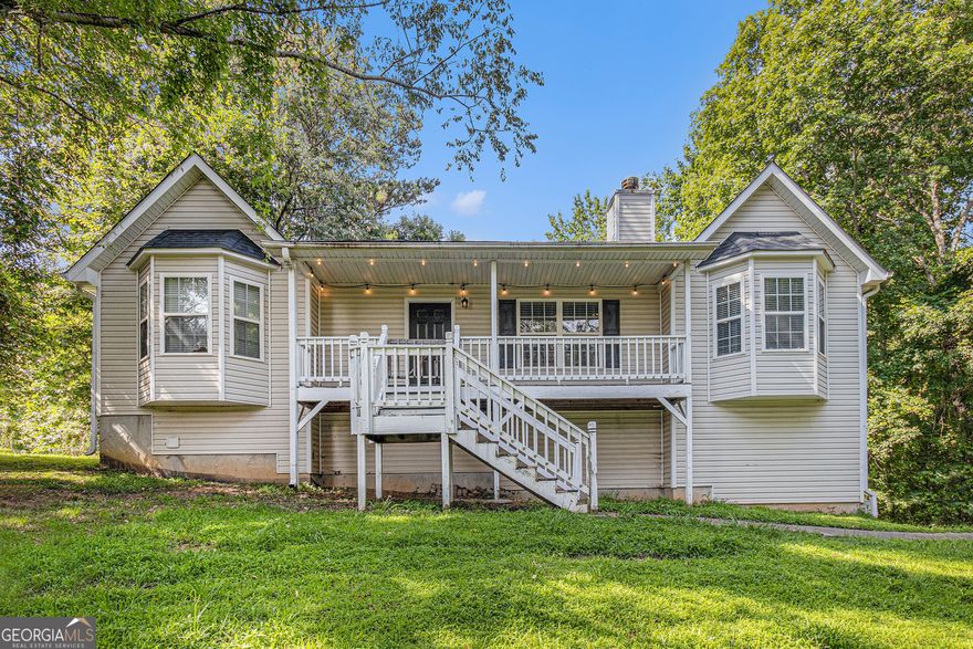 Welcome to this fabulous split-level home, nestled on a private and serene 0.84-acre lot. Enjoy peaceful mornings on the charming rocking chair front porch or relax on the spacious sun deck with stairs leading to the backyard. Move-in ready and beautifully maintained, this home offers 3 bedrooms, 2 full baths, and a fully finished, freshly painted basement featuring a versatile bonus room/office and a dedicated theatre/media room. The main level showcases a light-filled great room with vaulted ceilings and a striking stone-accented fireplace, perfect for cozy gatherings. The adjacent dining room flows into the kitchen, which is equipped with a breakfast bar for casual meals and entertaining. Retreat to the inviting primary suite with a bay window and a private bath that includes a garden tub for ultimate relaxation. Additional highlights include a 2-car garage and ample outdoor space for recreation and privacy. This home offers the perfect blend of comfort, space, and charm-don't miss it!