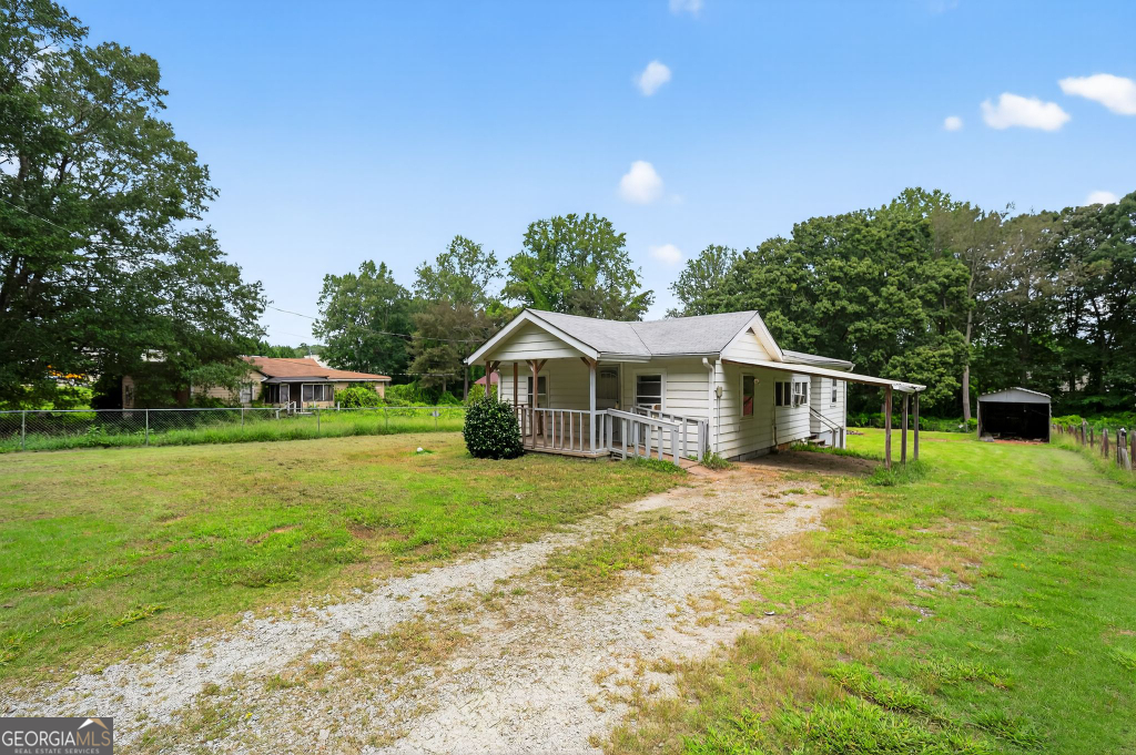 Discover this attractively priced investment opportunity in Union City, just 20 minutes from downtown Atlanta. This single-family home offers strong fundamentals with a sturdy 7-year-old roof, plus a barn, storage shed, and carport that add versatility and value. Requiring only cosmetic updates, it's an ideal flip or rental project with high-return potential. Modernizing the kitchen with updated cabinetry, countertops, and appliances, refreshing the bathroom with new fixtures and tile, and applying fresh interior and exterior paint will quickly maximize appeal. Optional upgrades like hardwood floors, a new HVAC system, and minor landscaping can further boost value, while improvements to the barn and shed enhance curb appeal. Close to shopping, dining at Shannon Mall, and outdoor recreation at Ronald Bridges Park, this property is perfectly positioned for appreciation and rental income in Union City's thriving market. This is the perfect opportunity for investors seeking a straightforward renovation with excellent upside potential in a growing community.