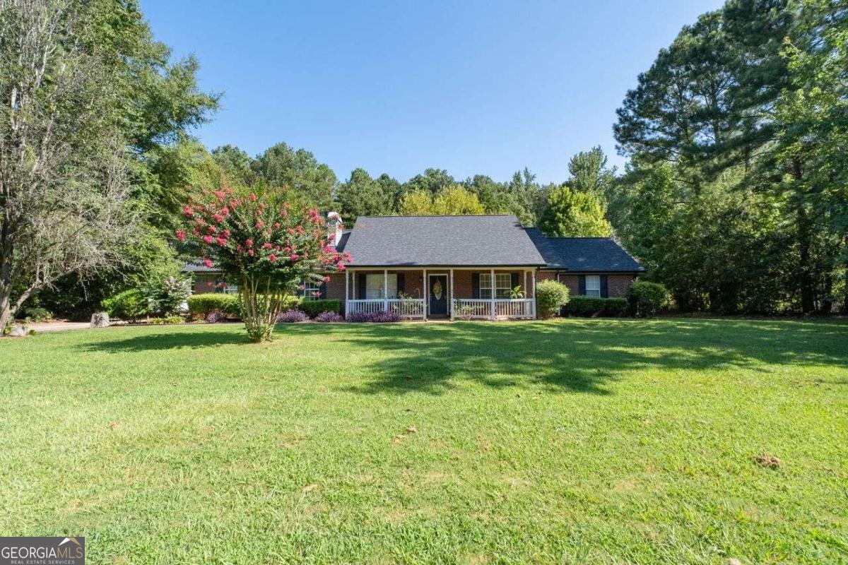Well maintained 4 bedroom 2 bath ranch. Vaulted ceilings in great room and master bedroom. Detached 1 car garage in addition to 2 car garage attached garage. Brand new roof & gutters. New extended patio. Close to award winning Ola school.