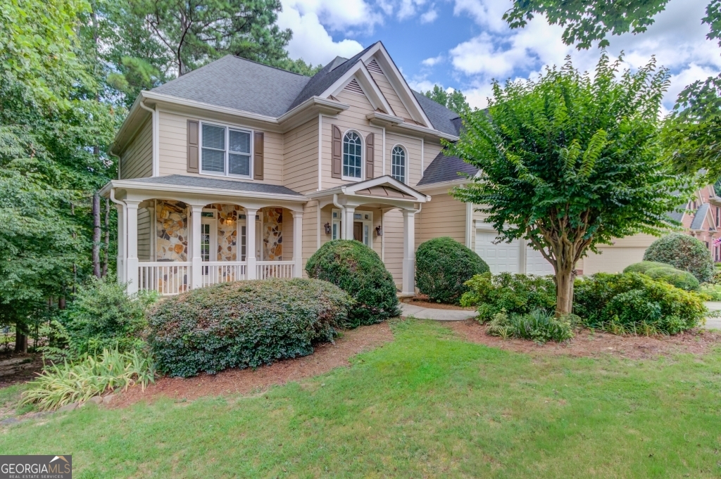 Motivated seller! Stunning 5 bedroom, 4.5 bathroom home with a 2 car garage on a full finished basement located in the highly sought-after Hamilton Mill community, featuring award-winning Mill Creek schools. Located just minutes from top-tier schools, dining and retail and with access to championship golf, swim, tennis, pickleball and clubhouse amenities, this exclusive residence offers an unparalleled lifestyle in one of the most coveted communities. Step inside to hardwood flooring for the entire house, fresh paint, vaulted ceilings, outdoor screen porch, former living and dining room with fireplace. Finished basement with full kitchen, bedroom, bath and storage" perfect for an in-law suite or guests. Enjoy a private, level backyard with oversized deck, covered porch and professional landscaping.