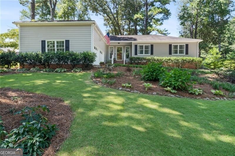 Welcome home to the most charming ranch, nestled in East Cobb's popular swim, tennis community, Heritage Farms! Situated on a large lot with mature landscaping, and conveniently located to shopping, dining, parks, and top-rated schools. Step inside to find a spacious foyer and fireside family room, with fresh, neutral finishes throughout and plenty of natural light. The inviting living room flows into the dining area and kitchen, as well as multiple outdoor living spaces. Sip your morning coffee or evening glass of wine on the cozy covered side porch, or host summer barbecues on the private back patio. The spacious primary suite includes a private ensuite bath and large walk-in closet, while two additional bedrooms share a full hall bath-perfect for family, guests, or a home office. Heritage Farms offers plenty of activities to enjoy throughout the year, including a swim team, pickleball team, tennis, playground and lake. One-year HSA home warranty available.