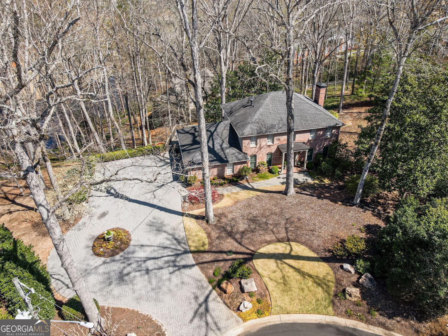 This home/ lot is situated on 1.27 acres overlooking the 7th green and 8th tee box. Adorned with soaring oak trees, this property offers stunning panoramic views of the fairway and the lake. It's a golfer's paradise with direct access to one of Georgia's top courses right in your backyard. The possibilities are endless- come update this home, or build your dream home. Come enjoy resort-style living at Atlanta Country Club while benefitting from low Cobb County taxes. You can easily ride your golf cart to the amenities, which are conveniently located near I-285, GA 400, and Sandy Springs.