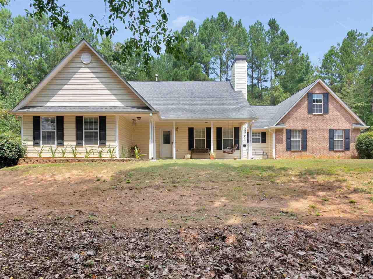 Ola Schools and Move in Ready! Welcoming front porch for your Rockers plus a private fenced Courtyard patio area. Nice size rooms throughout and be sure to see the easy to finish bonus room upstairs for super storage. Enjoy watching nature from the bay window kitchen eating area. Wooded backyard with great 12 X 24 workshop with electric making a great man cave/she shed for your tools and crafts! This fall it will be Firepit time! Nestled in a quiet community with no HOA and good size lots. One way in and one way out seclusion. Talk to Tammy to see today!