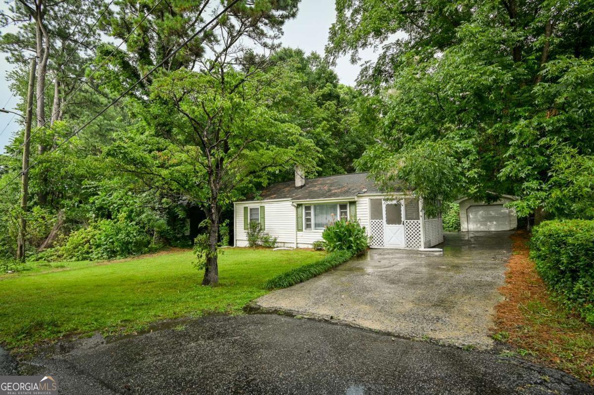 Charming Renovated Bungalow - Great Location! This beautifully updated 3-bedroom, 2-bath bungalow offers style, comfort, and convenience. It features a brand-new kitchen and bathrooms, high-end LVP flooring throughout, and all-new stainless steel appliances. With approximately 1,536 square feet of living space, with walk-in closets in all bedrooms. Enjoy outdoor living with a fenced backyard, a covered patio, and a cozy screened-in side porch. There's also a 1-car garage for parking or extra storage. Located in a friendly neighborhood, this home is within walking distance to the Forest Park Library and local parks. Plus, it's an easy commute to the airport and downtown Atlanta. Move-in ready and full of charm!