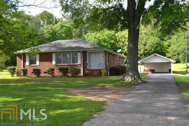 Totally adorable updated all brick home. 2-3 bedroom charmer with so much square footage. Modern kitchen with granite, new backsplash, new appliances, all woodfloors. 3 large living spaces and 1 that could be a huge 3rd bedroom. Wonderful workshop and carport. This home is turn key ready with fresh paint everywhere.