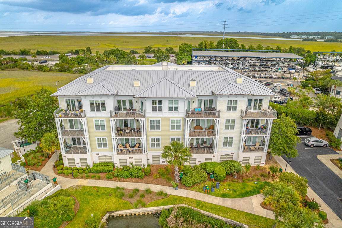 RENOVATED AND STYLISH WATERFRONT RETREAT AT THE GOLDEN ISLES MARINA - Perched on the edge of the picturesque Frederica River, this beautifully renovated 3-bedroom, 3-bath condo offers a serene coastal lifestyle with stunning waterfront views. Located at the coveted Waterfront at Golden Isles Marina, this home is your perfect escape to peace and style. Step out onto your private balcony to savor the ocean breeze and breathtaking sunrises, or cozy up by the fireplace in the open-concept living area-designed for both entertaining and relaxing. The spacious kitchen, ideal for the chef-at-heart, flows seamlessly into the dining and living spaces, all with panoramic views of the marina and passing boats. Access can also be gained from the primary bedroom and beautifully renovated primary bath. Enjoy sunny afternoons by the sparkling community pool, or take a short drive to the nearby village for local dining, shopping, and coastal charm. This condo isn't just a home-it's a lifestyle. Whether you're seeking a full-time residence or a vacation retreat, you'll love the blend of comfort, elegance, and scenic beauty.