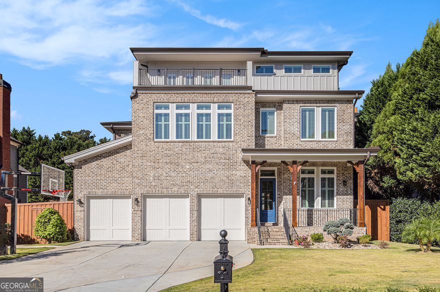 Modern Luxury in One of Atlanta's Most Desirable Neighborhoods. Discover the perfect blend of modern design, comfort and sophistication in this stunning newly-constructed home, completed in August, 2024. Situated in one of Atlanta's most sought-after neighborhoods and zoned for award-winning Ashford Park Elementary, Chamblee Middle and Chamblee Charter High, this residence offers not only luxury living, but also an exceptional location. From the moment you step inside, soaring 12-foot ceilings, plantation shutters and extensive trim and molding set a tone of refined elegance. Warm oak hardwood flooring flows throughout the main level, connecting the open living spaces with effortless grace. A versatile home office or guest bedroom, along with a secondary bedroom featuring its own private bath, offers flexibility for guests or remote work. On the second level, the primary suite provides a private retreat designed for rest and relaxation. Three additional bedrooms and a spacious bonus room offer plenty of room for family, hobbies or entertainment. The third level is an entertainer's dream - featuring two expansive rooms perfect for gatherings, media or recreation, along with two additional bedrooms, one with its own private bath. Step outside to the balcony for a peaceful escape and enjoy elevated views of the surrounding neighborhood. Outside, your private backyard oasis awaits. Gather with family and friends in the bright solarium, prepare gourmet meals in the full outdoor kitchen with sink area and large grill, or unwind in the beautifully landscaped garden area. For recreation, enjoy the home's unique putting greens, offering a one-of-a-kind touch of fun and relaxation. With a three-car garage, additional driveway parking, and an ideal location near parks, dining, shopping and major highways, this home delivers a lifestyle of convenience and distinction. Every detail has been thoughtfully designed to combine architectural beauty with everyday functionality. This is modern living at its finest - an exceptional home where quality, comfort and craftsmanship come together in perfect harmony.