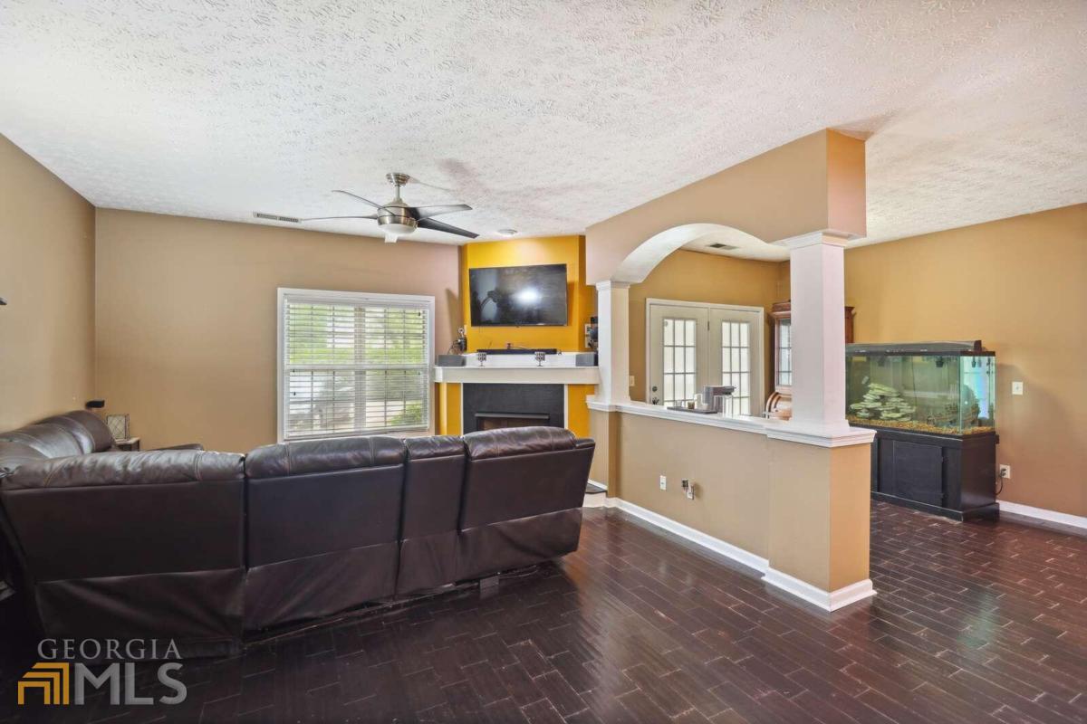 This absolutely astonishing condominium WILL NOT LAST LONG!!! It is a lavishly kept 2 bedroom, 2 full bathrooms and walk-in closet condominium with a roommate style, open floor plan. It is accommodating with brick style wood floors throughout the dinning room, living room and enclosed wall unit book shelf area. The kitchen provides exquisite flooring that blends perfectly with the expresso cabinetry. Matching Stainless Steel appliances which include: built in microwave, gas/griddle stove top/oven, dual vertical door refrigerator and a neatly tucked private reserved wine cellar. The kitchen lighting accents the kitchen combination perfectly. The master bedroom and bathroom exhibits a welcoming display of rest and relaxation with the tranquil color tone and placement of the high stone tiled walls and shower floor and oversized shower heads on each end of the transparent enclosed glass shower. THIS UNIT IS A MUST SEE!!!