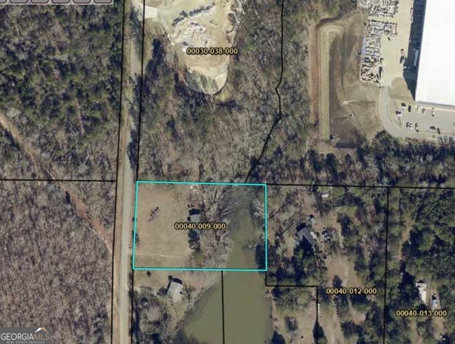 Endless Possibilities on This Stunning approx 2.5-Acre Lot! Discover the perfect canvas for your dream project-whether it's building your forever home or developing a potential commercial space. This beautiful and versatile parcel offers level topography, making it ideal for construction. Nestled among mature hardwoods, the land provides serene surroundings, creating a peaceful retreat just waiting to be transformed. One of the property's most captivating features is the picturesque pond at the rear, adding charm and tranquility that few properties can match. With ample space and natural beauty, this lot is a rare opportunity!! Don't miss your chance to turn this unique piece of land into something truly special!