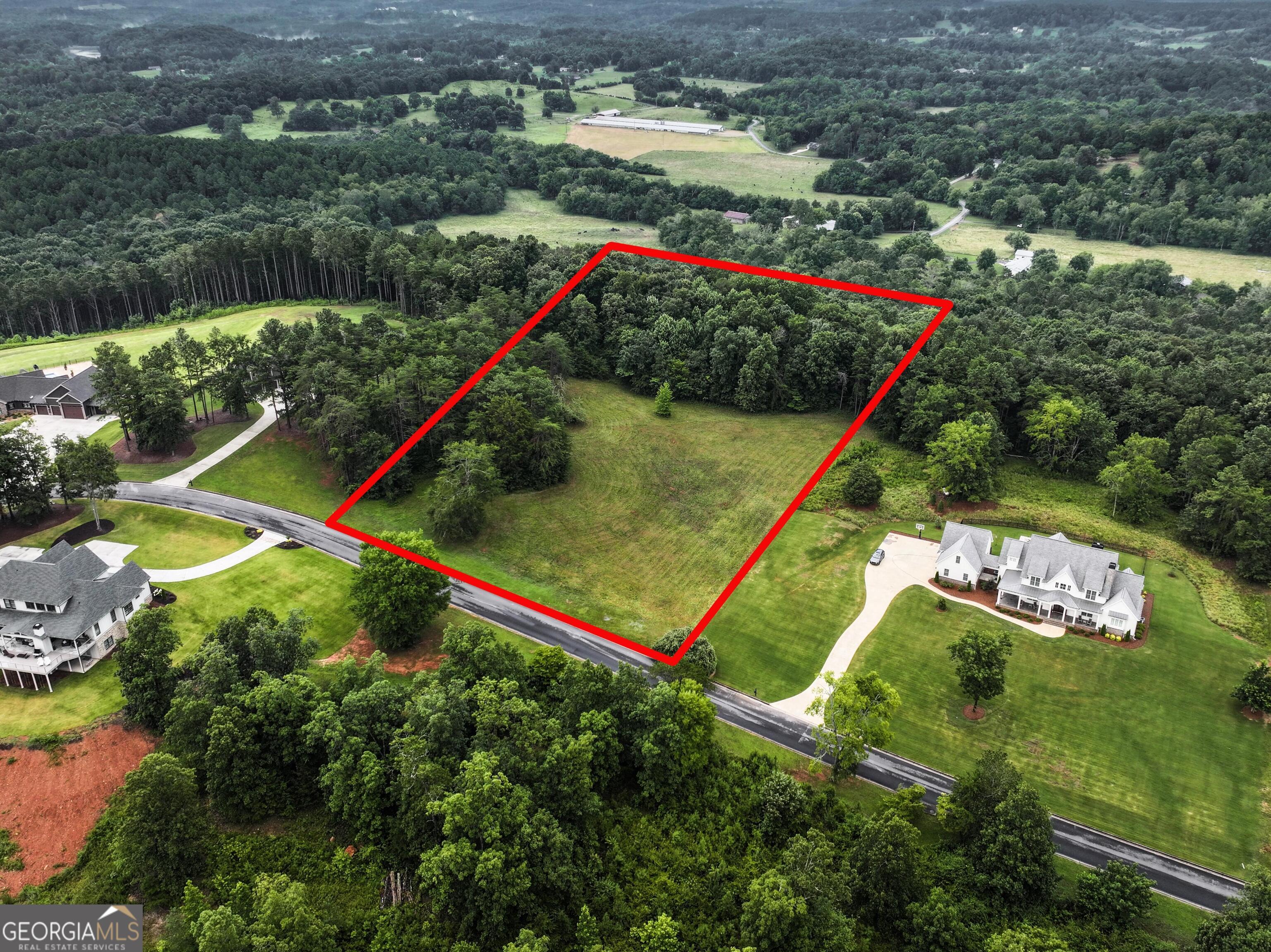 Luxury estate five acre property located in Gordon County within the high end Pine Mountain subdivision, just minutes from I-75 and downtown Calhoun. This beautiful five acre property is surrounded with breathtaking mountain views - an amazing opportunity to build your dream home surrounded by nature's beauty. The land is bordered with mature trees offering privacy and only 16 miles from the sought after Barnsley Resort. Water and power are available from the road. Level 3 soil analysis is available upon request for septic. If you walk the property you can view the boundaries marked by posts and colored tape. Don't miss the chance to make this property your own personal haven.