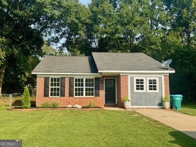 Charming Renovated 3-Bedroom Home in Prime Location! Discover your dream home in this beautifully renovated 3-bedroom, 2-bath residence. Step into a bright living room that seamlessly flows into a modern kitchen, featuring sleek new white cabinets, stainless steel appliances, and stunning countertops-perfect for entertaining or family gatherings. Enjoy the elegance of new light fixtures illuminating the space, complemented by stylish laminate flooring throughout. Fenced in backyard. This home not only offers comfort but also convenience, situated just moments away from vibrant downtown shops and restaurants. Professional pictures coming soon!