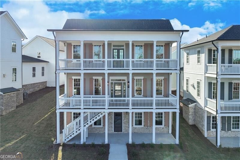 **Special Financing Available **One of the distinctive "Six Sisters" at Homestead at Hog Mountain, this charming property was crafted by one of our preferred architects, Alison Ramsey, drawing inspiration from San Francisco's iconic "Painted Ladies". This adaptable plan, artfully designed for versatility, boasts 5 bedrooms and 5.5 bathrooms, and is gracefully spread across three levels of living space. Highlights include an open kitchen with a central island and dining area, a cozy study or office complete with a fireplace, a bright and airy sunroom, and a spacious family/media room equipped with a built-in kitchenette. Additionally, with its own entrance, the lower level offers private access and encompasses 2 bedrooms, 2 bathrooms and the family/media room with kitchenette. Along with the unfinished ADU space above the garage, this thoughtfully crafted layout allows the home to adapt to your needs and provides an ideal haven for multigenerational living options.