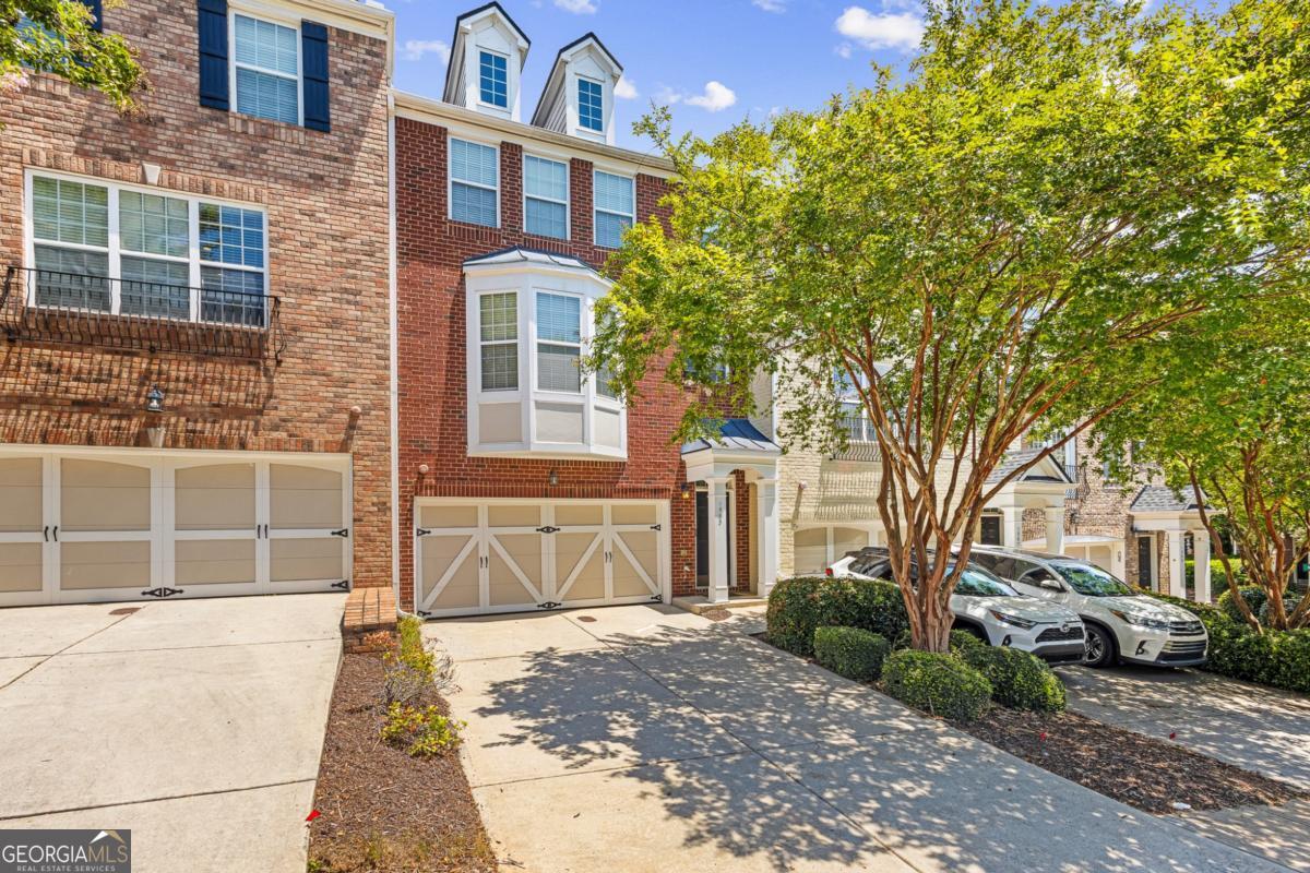 Experience refined Southern living in this exquisitely furnished 4-bedroom, 3.5-bath luxury home, perfectly positioned in one of Atlanta's most desirable enclaves-just moments from The Battery, Mercedes-Benz Stadium, and the vibrant heart of Downtown Atlanta. From the moment you enter, you're greeted by soaring ceilings, rich hardwood flooring, and an abundance of natural light that enhances the open-concept layout. Every detail of this designer-curated residence exudes elegance-from the custom millwork to the upscale furnishings thoughtfully selected for comfort and style. The gourmet kitchen is a culinary showpiece, featuring high-end stainless steel appliances, granite countertops, and a generous island ideal for hosting or enjoying quiet morning coffee. The expansive living area centers around a sophisticated fireplace, creating a warm and inviting ambiance perfect for entertaining. Retreat to the palatial primary suite, a true sanctuary complete with a spa-inspired en-suite bath, dual vanities, a soaking tub, and an oversized walk-in closet. Three additional bedrooms offer plush accommodations for guests or flexible space for work and leisure. The fully finished terrace level provides a second living area, full bath, and limitless potential for a private guest suite, media lounge, or home gym. Step outside to a serene private deck-your own outdoor escape nestled within a quiet, upscale community. With seamless access to major interstates and Atlanta's premier attractions, dining, and shopping destinations, this home perfectly balances luxurious comfort with metropolitan convenience.