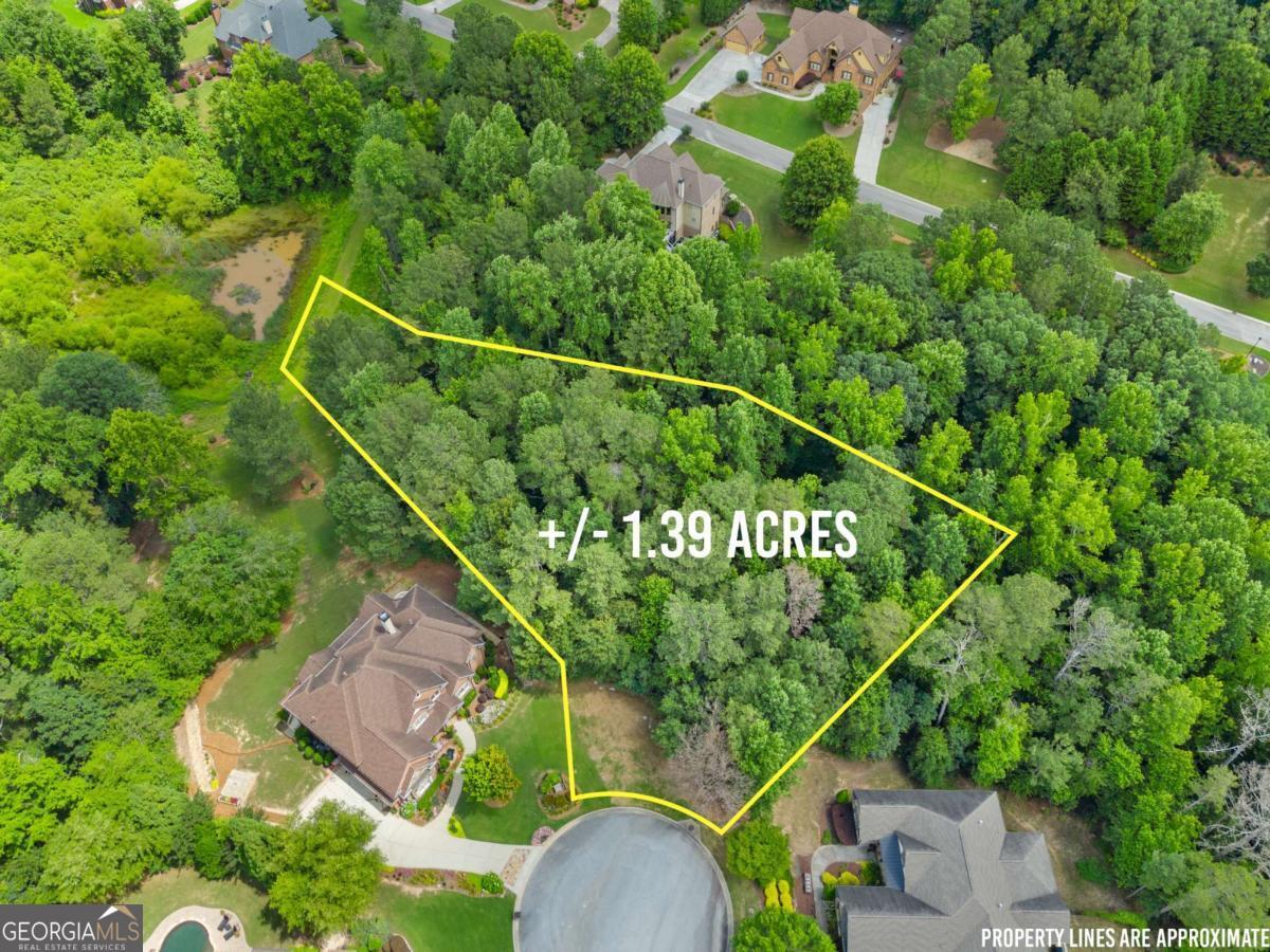 1.39 ACRE Lot in Prestigious Quailwood - Build Your Dream Home! Don't miss this rare opportunity to own one of the final homesites in the highly sought-after Quailwood community in Flowery Branch. Nestled at the end of a quiet cul-de-sac, this spacious 1.39-acre lot offers the perfect setting for your custom-built dream home. Located in an exclusive, private neighborhood featuring fewer than 150 homesites-each a minimum of one acre-Quailwood is known for its elegant homes, tranquil surroundings, and a true sense of community. This premium lot offers privacy, space, and serenity, with plenty of room for outdoor living. Enjoy peaceful suburban living while being just minutes from shopping, dining, top-rated schools, and Lake Lanier. **Lot outline is an estimate and should not be relied upon for exact boundaries. Refer to a professional survey for precise measurements.**