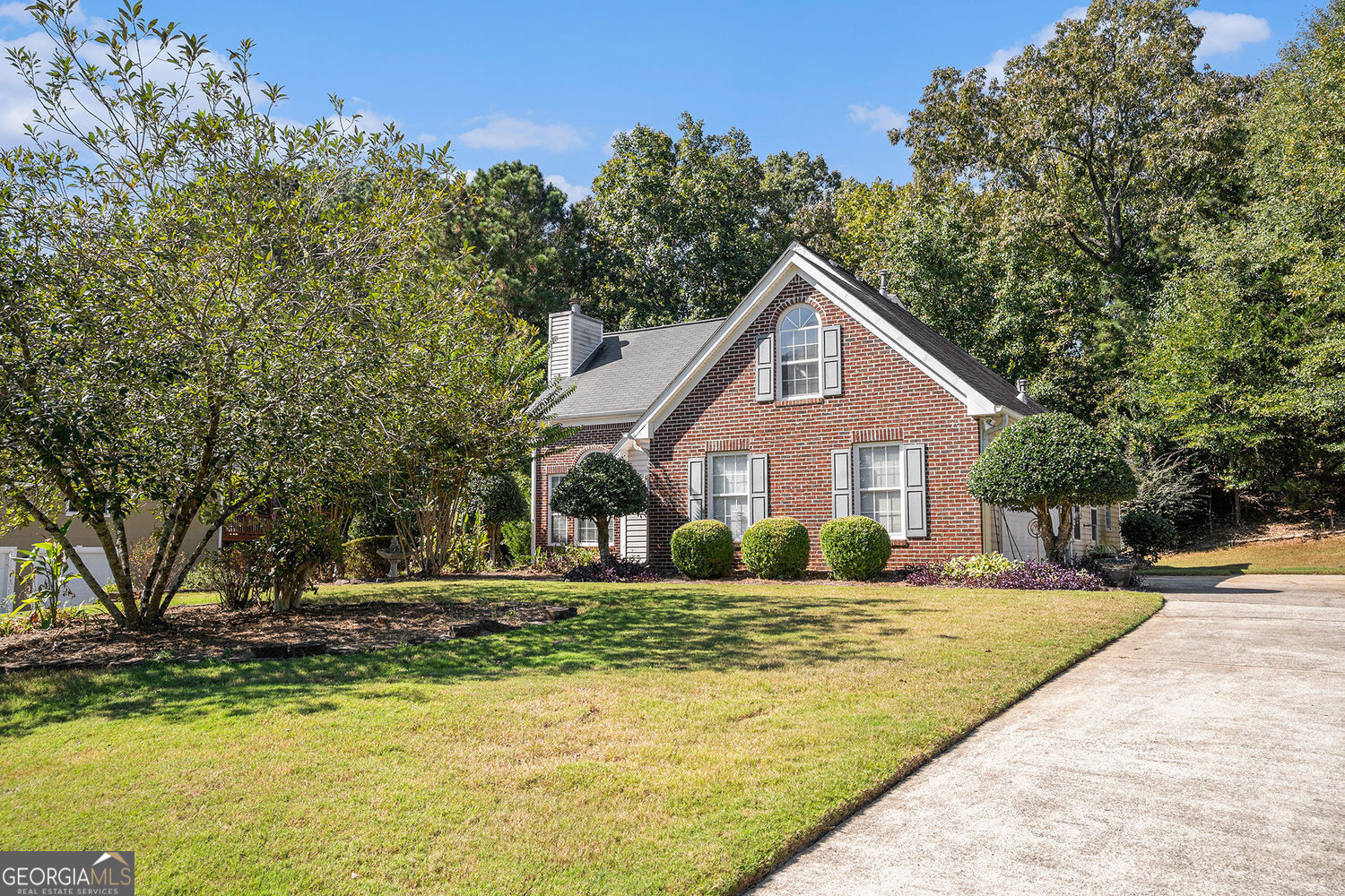 Welcome to this beautifully maintained traditional ranch home featuring a brick-front exterior and spacious interior layout. The open-concept family room offers a cozy fireplace and seamlessly flows into the dining area. The tiled kitchen boasts ample cabinet space, a breakfast area, laundry room and direct access to the extended patio-perfect for outdoor entertaining. French doors from the dining area lead to the private backyard oasis, offering peace and privacy with wooded views. The primary suite is conveniently located on the main floor and includes a walk-in closet, double vanity, garden tub, and separate shower. Upstairs, you will find two large secondary bedrooms, a full hall bathroom, and a versatile bonus room that could easily be the 4th bedroom or just add doors to transform it into the ideal office, playroom, game room, or man cave! Outside, enjoy low-maintenance landscaping with established perennials and a serene, wooded backdrop. Nestled in a well-established, family-friendly neighborhood with convenient access to everything you need. Don't miss your chance-this home won't last long!