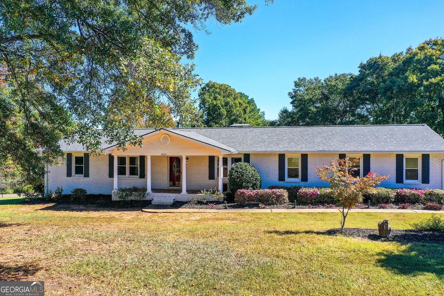 Welcome to this stunning ranch-style fully renovated home on a finished basement, offering the perfect blend of comfort, functionality, and charm. Thoughtfully designed with 3 spacious bedrooms and 3 full bathrooms, this residence boasts multiple gathering spaces including two inviting fireside (natural gas logs) family rooms and a bright sunroom ideal for year-round enjoyment. The lower level offers incredible flexibility featuring a bonus room with a large walk-in closet that can easily serve as a 4th bedroom, guest suite, or home office. You'll also find a dedicated exercise room, abundant storage, and a versatile workshop/garage area for your hobbies or projects. Enter through the welcoming foyer and discover a gracious dining room that flows seamlessly into the open-concept kitchen and living area. The kitchen features rich wood cabinetry, solid-surface countertops, a convenient peninsula, exterior vented hood perfect for everyday meals and entertaining alike and a walk-in pantry and laundry room. Energy efficiency is built right in with spray foam attic insulation, plus the home is equipped with a modern security system and interior/exterior cameras for peace of mind. A new sewer line was added in 2023, ensuring years of worry-free living. Step outside to your own private retreat! The beautifully landscaped yard is a gardener's dream complete with raised beds, fruit trees (including persimmon, fig, peach, pear, and date), and even strawberries and exotic annuals. Towering cypress trees in front provide additional privacy, while the wrap-around driveway offers dual access entry and exit from both Trickum Road and Wagon Trail for easy convenience. Gather around the fire pit, relax under the gazebo, or enjoy grilling on the natural gas BBQ perfect for weekend entertaining. Car enthusiasts and hobbyists will love the abundance of parking and storage options: an attached 3-car garage, a detached metal garage, and a dedicated RV/boat garage with a built-in sewer connection for convenience. Located in a highly sought-after area with excellent schools, easy access to I-575, and close proximity to shopping and restaurants this home truly has it all. Come experience the lifestyle you've been looking for!