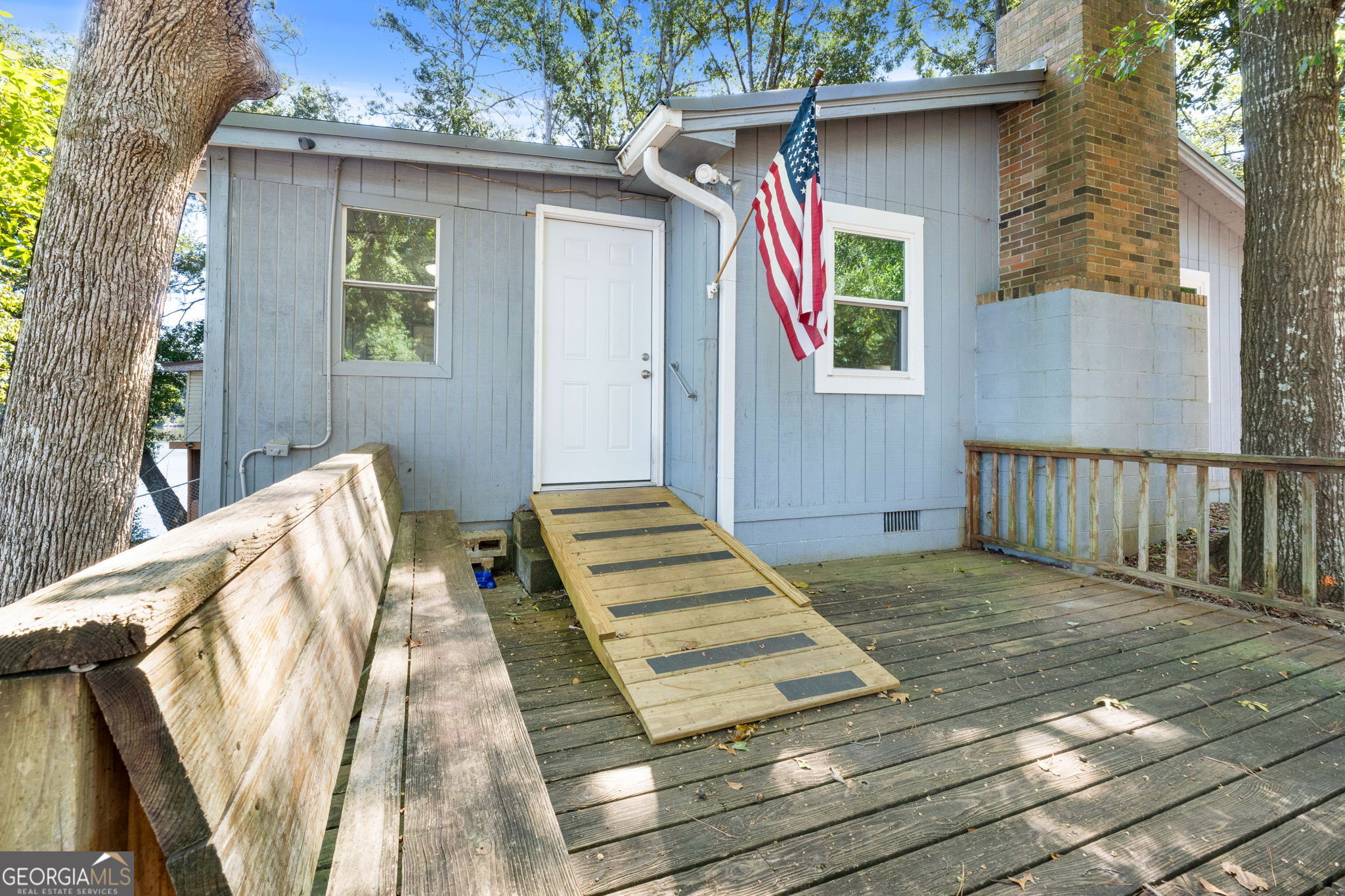 Welcome to your own slice of lakefront paradise! This charming 2 bedroom, 1 bath move-in ready home is perfectly situated on the shores of beautiful High Falls Lake. Whether you love boating, fishing, kayaking, or simply relaxing by the water, this home offers the perfect setting for weekend getaways or full-time lake living. Step inside and enjoy a thoughtfully designed layout that maximizes both comfort and views. The sunroom is the perfect spot to unwind or entertain friends. Just outside, a deck overlooking the water makes outdoor living easy, from cookouts to sunset watching.The large laundry room doubles as a storage area, providing extra flexibility, while a separate shed on the property offers even more storage for lake gear, tools, or hobbies. A private dock completes the package, giving you direct access to the lake for endless days of recreation. With mature trees and peaceful surroundings, you'll feel tucked away from it all while still being close to local conveniences and easy access to I-75. Don't miss this rare opportunity to own a home on High Falls Lake-perfect for a vacation retreat, investment property, or your forever lakefront escape.