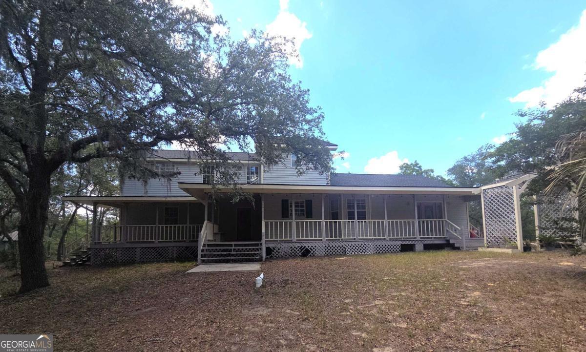 Spacious 5-bedroom, 3-bath home with 3,688 sq ft of versatile living space! This 1.5-story property features a separate kitchen and living area, perfect for extended family or potential rental income. Enjoy the outdoors from the inviting front porch, back deck, and private balconies. With tons of potential, this home is ready for your personal touch-don't miss out on this unique opportunity!Agents must register as a User, enter the property address, and click on"Start Offer". This property may qualify for Seller Financing (Vendee). If property was built prior to 1978, lead based paint potentially exists. EMmust be made out to the Closing Attorney. Property is being "SOLD AS IS".