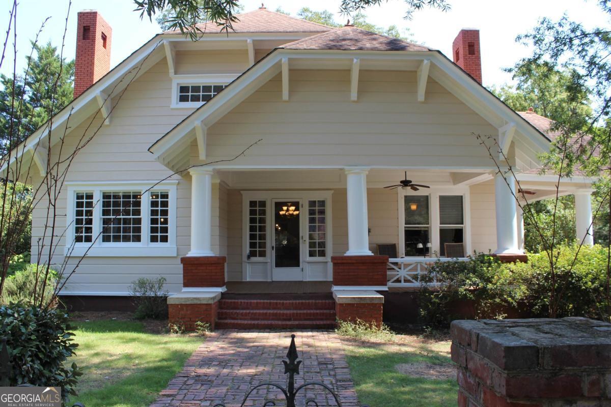 This 1906 Craftsman Style home lies in the heart of sleepy downtown Eatonton. Uncomplicate your life. This house is a dream. The home remained in one family until 6 years ago. It has tons of authentic character and is comfortable to boot. Original pine floors, doors, mantles with beautiful hearths, original glass in her windows, and a completely private, fenced, back yard. House is sound; they don't build them like this one anymore! The grand lady has been gone over from stem to stern with fresh caulk, new boards where needed, scraping and sanding, and a fresh coat of paint. All of this tender love and care will provide you with lots of time to sit in a rocker on the covered front porch and waive to your new neighbors. Staged furnishings available to sell with property, separately.