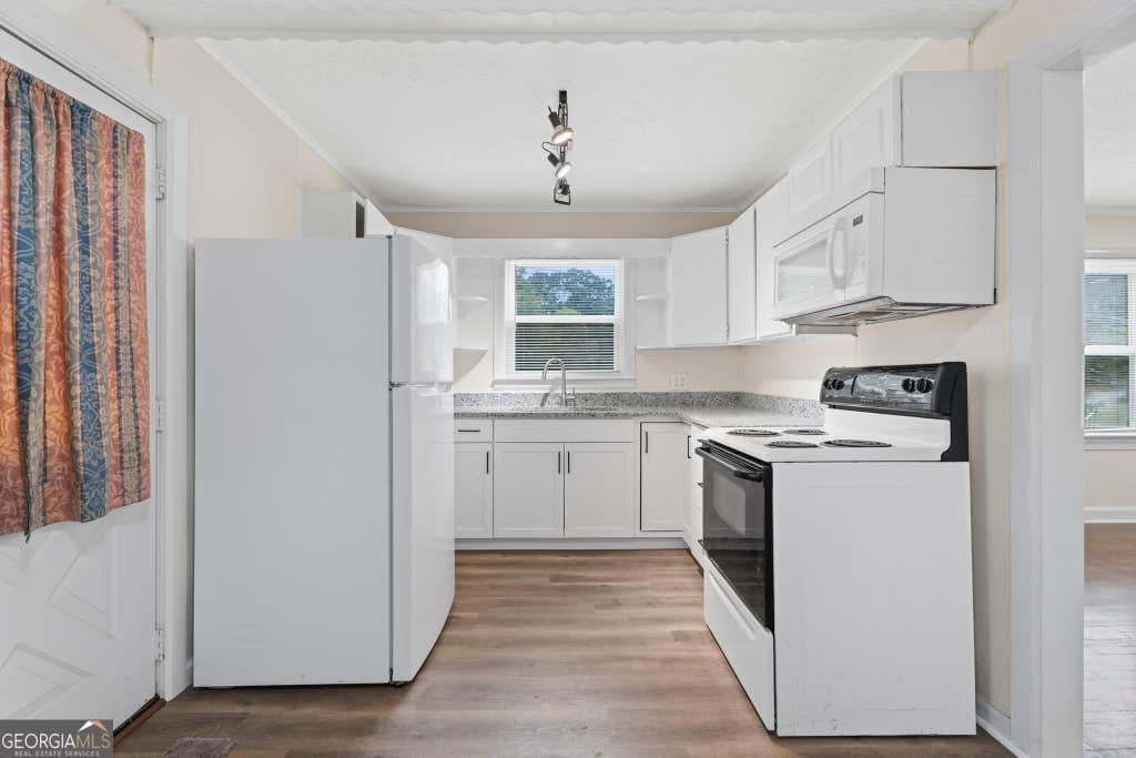 Photo of 802 Bridge Avenue, Forest Park, GA 30297 (MLS # 10812921)
