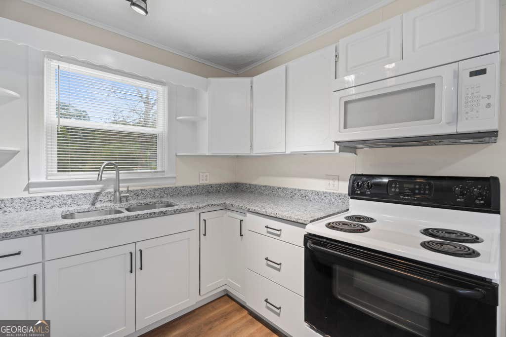 Photo of 802 Bridge Avenue, Forest Park, GA 30297 (MLS # 10812921)