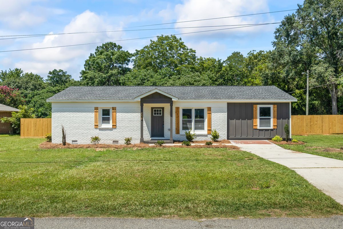 Welcome home to this newly RENOVATED property located less than 1 mile from Downtown Social Circle. This 3 bedroom/ 2 bath home is practically BRAND NEW being RENOVATED down to the studs. RENOVATIONS include a NEW roof, NEW high efficiency 18 seer hvac system, NEW water heater, NEW windows, NEW sheetrock, NEW electrical, NEW plumbing, NEW kitchen with granite & stainless appliances, NEW baths, NEW flooring, NEW light fixtures, NEW plumbing fixtures, NEW interior & exterior doors, NEW interior trim, NEW interior & exterior paint, NEW electric fireplace, NEW Hardi siding, NEW spray foam insulation, NEW back deck, NEW privacy fence plus a storage building in back yard. Social Circle Schools! Contact your Realtor to schedule your private showing before it's gone!