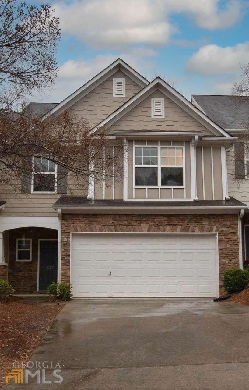 Looking for Low maintenance living in sought after Mountain Brook!!! Prime location close to Woodstock and Roswell This home has an incredible open concept layout that is great for entertaining. Eat in kitchen with breakfast bar and pantry. Beautiful family room with an amazing wall of windows letting in natural light. Large master with trey ceiling and master bath has dual vanities, soaking tub and updated shower. Upstairs is complete with two secondary bedrooms, full bath and laundry room. New carpet, interior painted and new master shower. Move in ready!!!