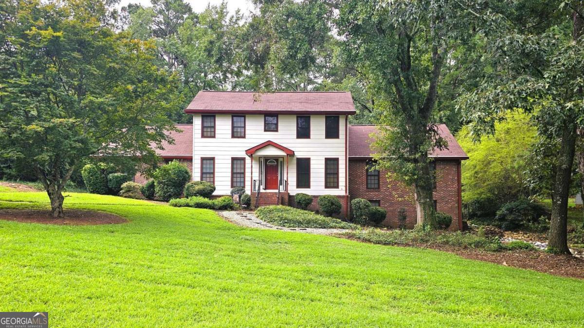 Huge 4/3 on a quiet street! Ready for a fantastic family house you can put your own personal touch on? Nestled on .9 acres on a quiet suburban street, this 4 bedroom, 3 bath house offers over 3,500 finished SF and is just waiting for you!! Its highlights include a master on main, eat-in kitchen, finished basement, huge bonus room, tons of storage and an inviting 4-seasons glassed-in patio overlooking a spacious deck and gorgeous fenced back yard. Plus... the adjoining family room includes a cozy fireplace and vaulted ceiling. The huge 4-seasons patio, which opens to a spacious deck and fenced private backyard, is ideal for pets, play, or outdoor gatherings. The finished basement offers even more living space, complete with a bar area, brand-new LVP flooring, and 1800's "square grand" piano, making it great for a separate entertaining area. This home has been meticulously maintained is and ready for your personal updates and design touches. Don't miss this rare opportunity to own a large home in a peaceful, established Conyers neighborhood!