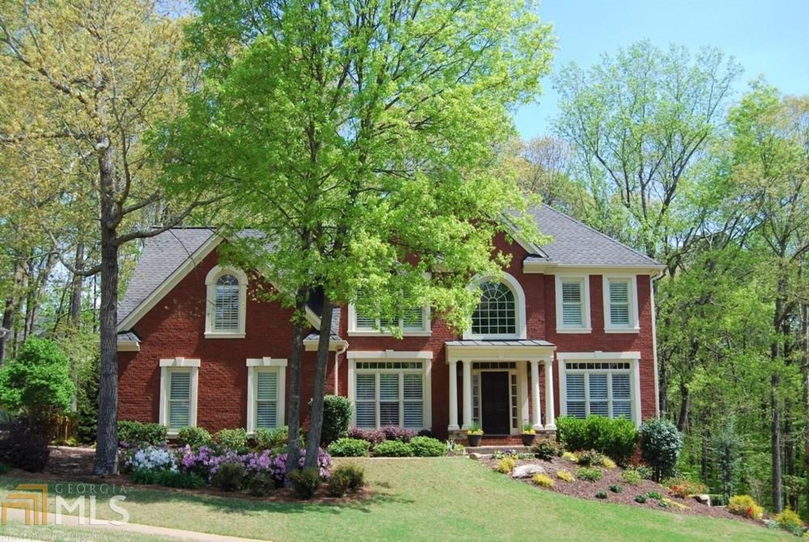 Meticulously maintained, one-owner home! Brick front, side-entry garage,newly refinished hardwoods thruout main level*Plantation shutters*Main floor study*Updated kitchen&master bath!*Two-story great room*Separate living&dining rms*Bayed b'fast area in kitchen+b'fast bar,stained cabs,slate tile backsplash,stainless appliances*Two-story stone fireplace w/ gas logs*Dimensional shingled roof*Newer garage doors&openers*Large deck w/ built-in gas grill*Professionally fin BSMT w/ smooth ceilings, recessed lighting, full bath & party kitchen, separate storage rm*Newer Trane HVAC systems*Double-paned windows*Termite repair&retreat warranty*Professional landscaping,paver walkways,fenced rear yard*Friendly swim/tennis community in Towne Lake*All the best schools!*