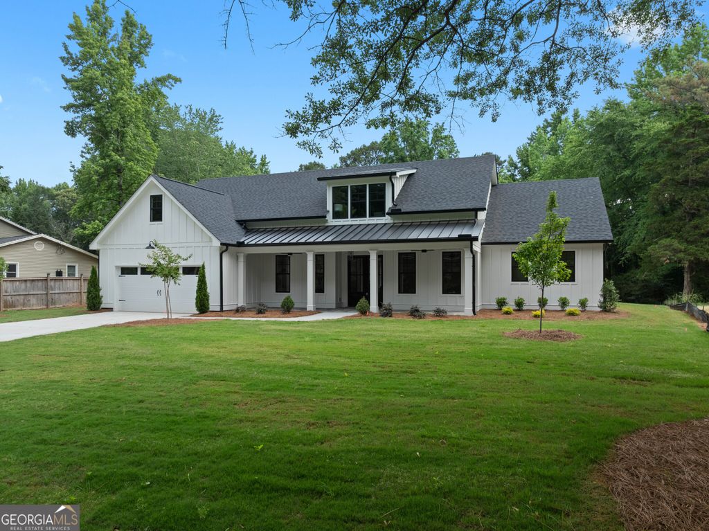 Photo of 1728 Pucketts Drive SW, Lilburn, GA 30047 (MLS # 10770432)