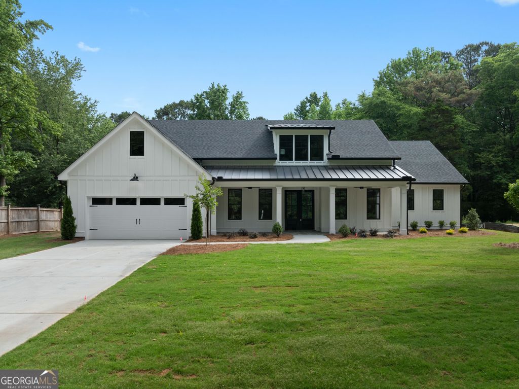 Photo of 1728 Pucketts Drive SW, Lilburn, GA 30047 (MLS # 10770432)