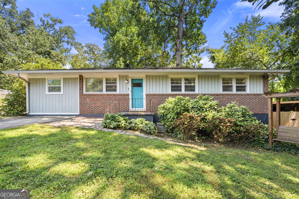 This Medlock Park home is a unique find in a wonderful neighborhood. A full kitchen remodel transforms this house into a spacious living space. Being located at the end of a quiet street with plenty of privacy, but easy walking access to the PATH trail/Emory makes this house both central and secluded. Enjoy an upper backyard with a hot tub / fire pit and a lower back yard with a putting green / golf simulator. This house is a hole in one!